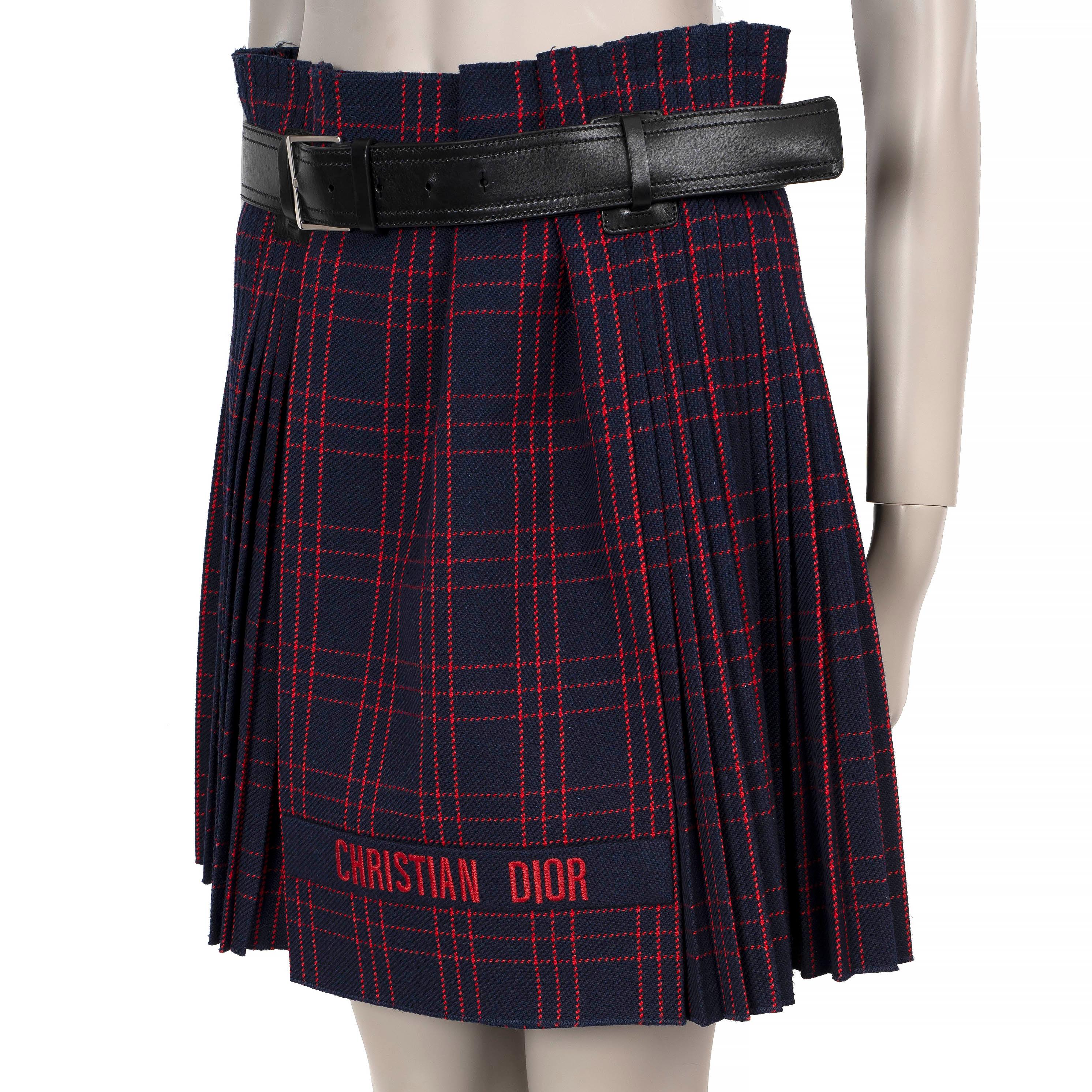 This 100% authentic Christian Dior kilt skirt in navy blue and red tartan plaid wool (100%) combines timeless heritage style with a modern twist. Featuring a high waist, classic pleats, and a sleek flat front with bold logo embroidery, it exudes