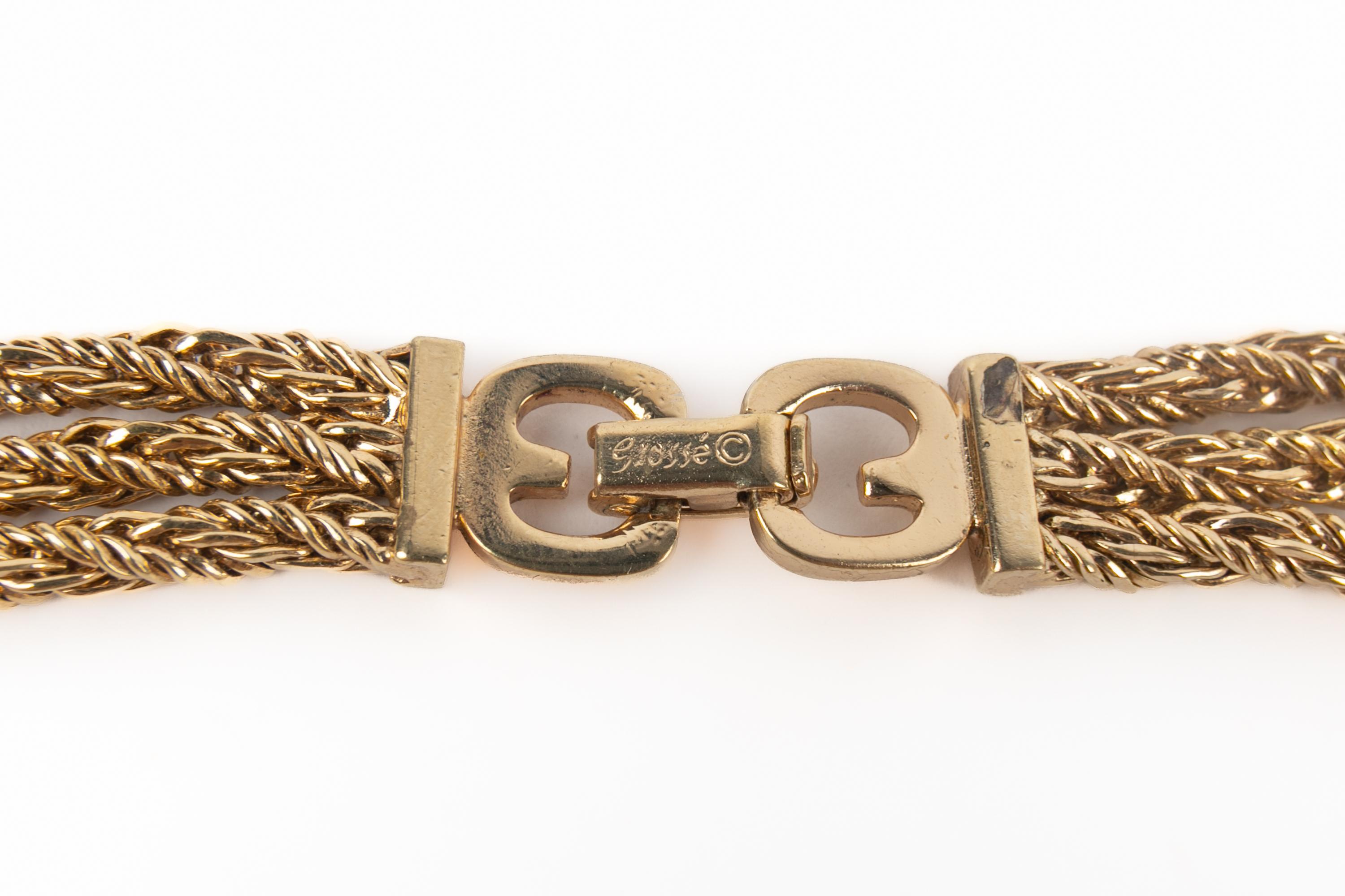 DIOR - Halskette 'Löwenkopf' aus goldenem Metall mit Strasssteinen. Schmuck aus dem Hause Grossé für  Dior.

Bedingung:
Sehr guter Zustand

Abmessungen:
Länge: 48 cm

SKU:BC35
