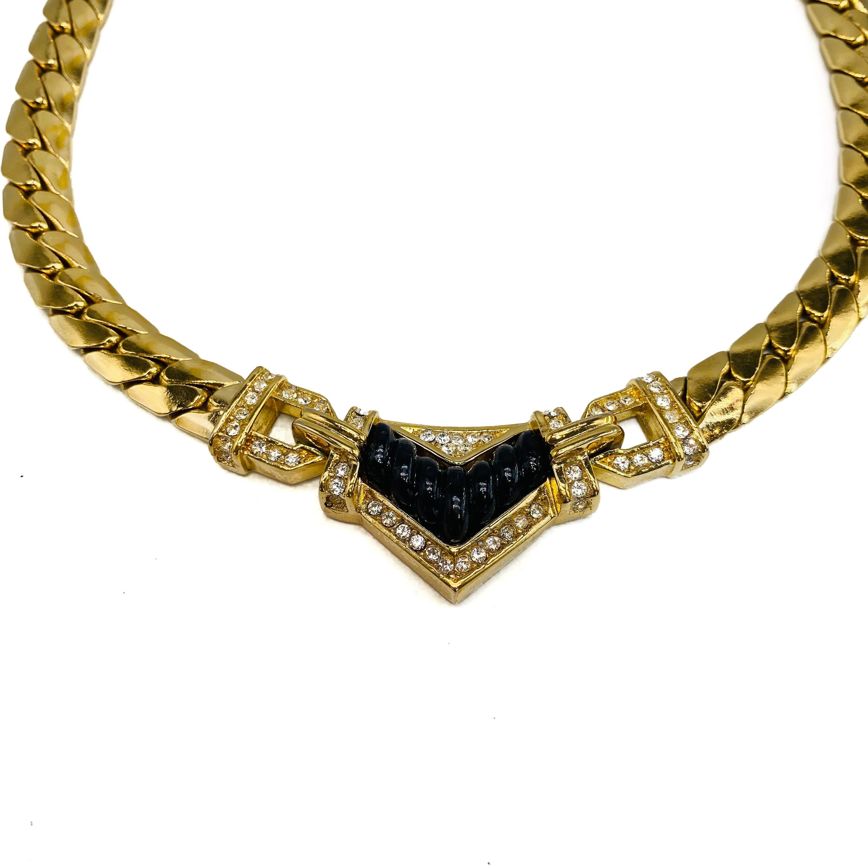 Christian Dior Vintage 1980s Necklace
An incredible statement piece from the House of Dior, still one of the world's most desirable labels today

Detail
-Cast from gold plated metal
-Made in France in the 1980s
-A centre black coloured stone,