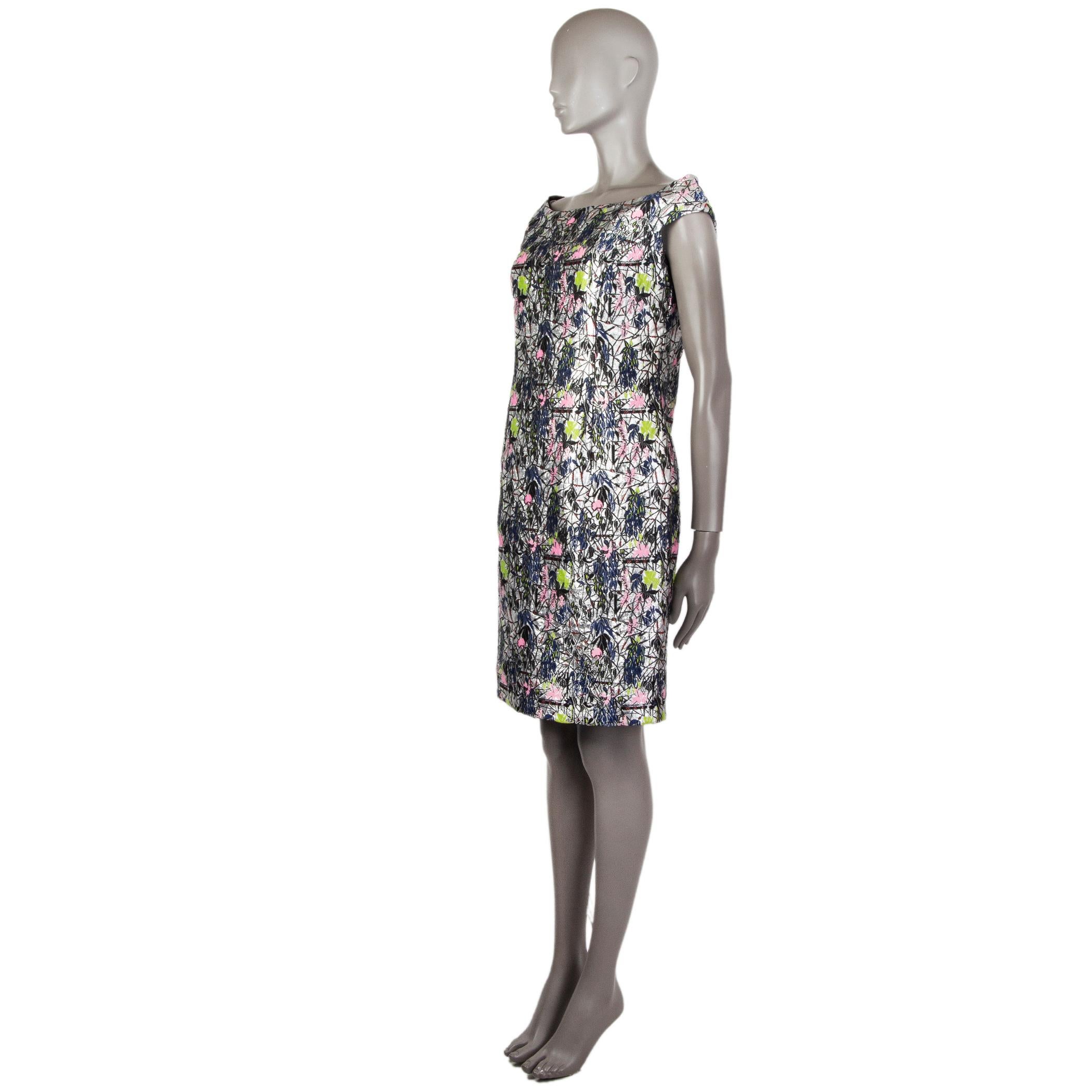 Christian Dior floral borcade sheath dress in silver, indigo, pink, chartreuse, black, and red polyester (67%) and nylon (13%). With boat neck and cap sleeves. Closes with hook and invisible zipper on the back. Lined in black silk (100%). Has been
