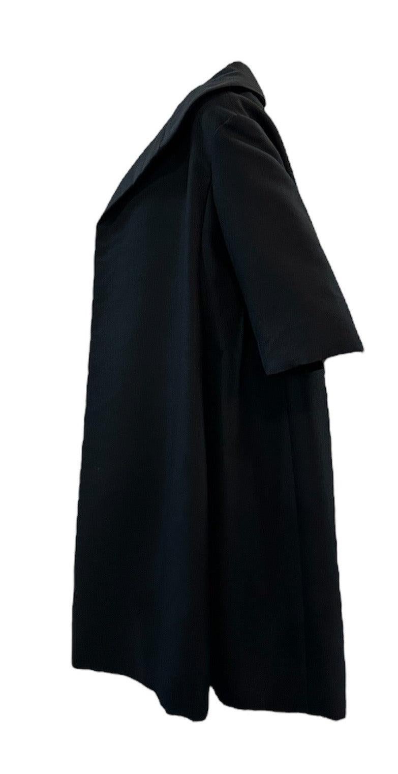 1950s era Christian Dior Original coat for the house's New York label. Medium weight spring/summer. Open front with wide collar to be worn up for more drama or down for an afternoon stroll. Quarter length sleeves and fully lined. From Saks Fifth