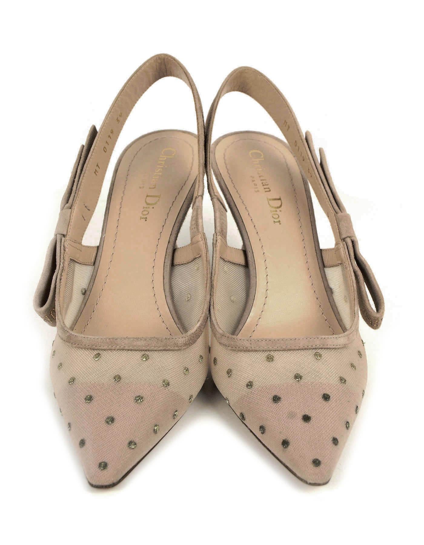 Christian Dior Nude Plumetis J’ADIOR Slingback Pumps

Made In: Italy
Color: Nude
Materials: Suede & crystals
Closure/Opening: Slingbacks
Overall Condition: New with the exception of a small mark to outer shoe from improper storage (see last