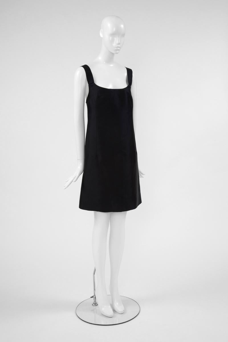 To my opinion, this 60’s Christian Dior is the perfect “Little Black Dress” that every woman should have in her dressing ! Constructed in heavy black silk, the cocktail dress features a plunging scoop neckline. It appears suspended with large straps