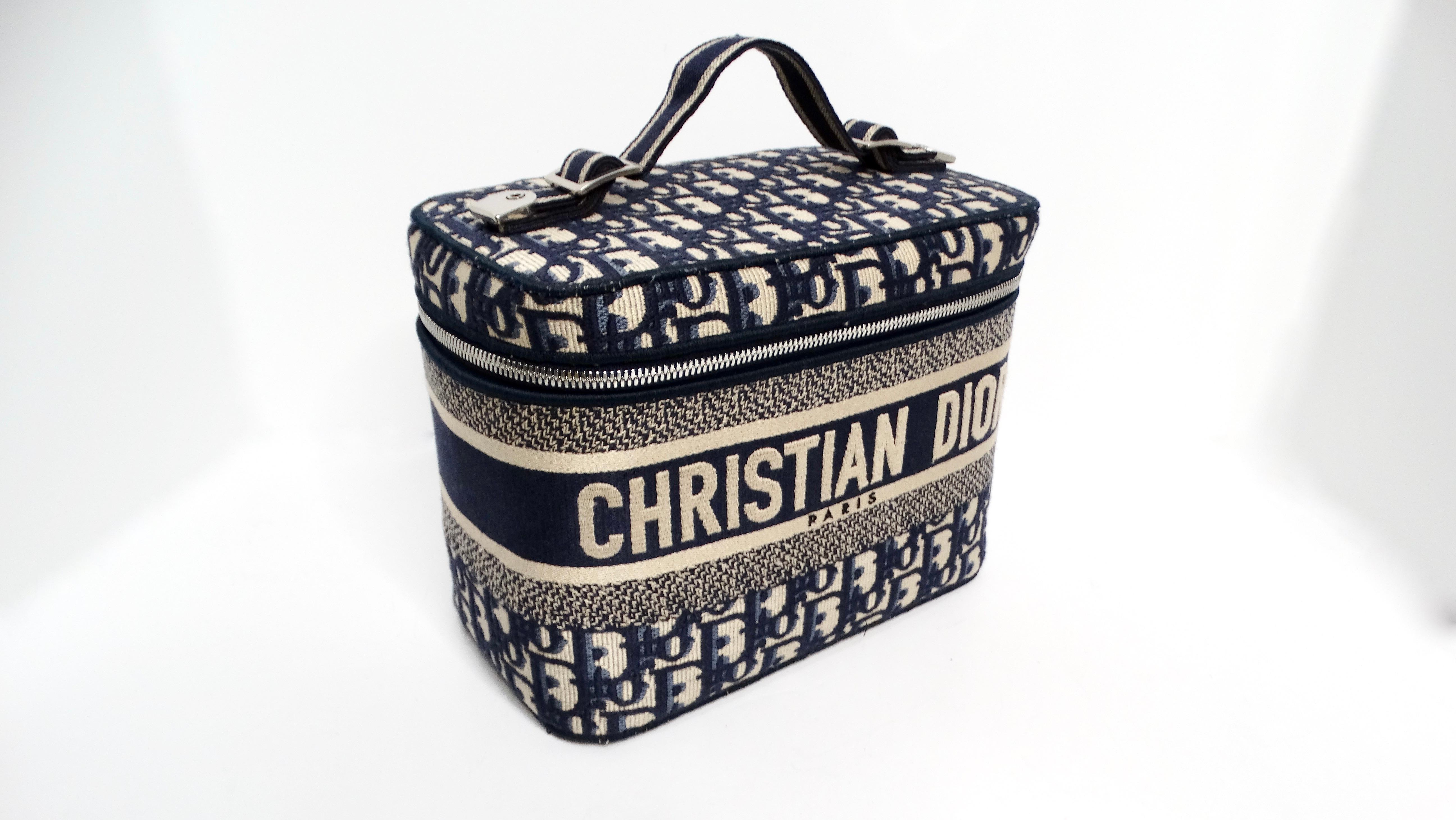 The Christian Dior Oblique Monogram Canvas Travel Vanity Case is an exquisite blend of functionality and luxury, perfect for the modern traveler. This stylish rectangular cube bag is crafted from durable canvas, showcasing the classic Christian Dior