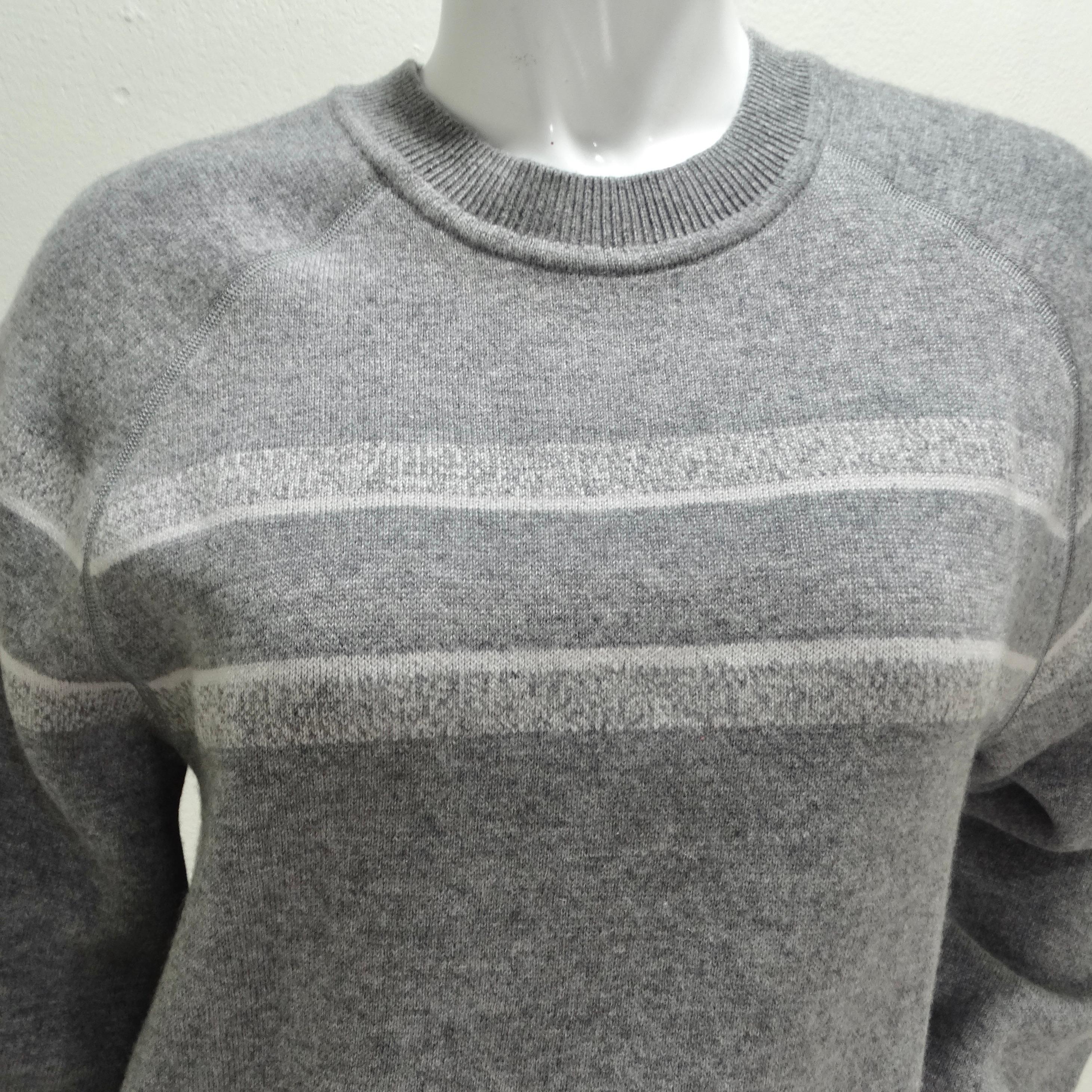 Wrap yourself in opulence with the Christian Dior Oblique Reversible Cashmere Knit Sweater. This oversized, cozy crew neck sweater, crafted from the most luxurious thick cashmere elastane blend, ensures unparalleled comfort. The standout design