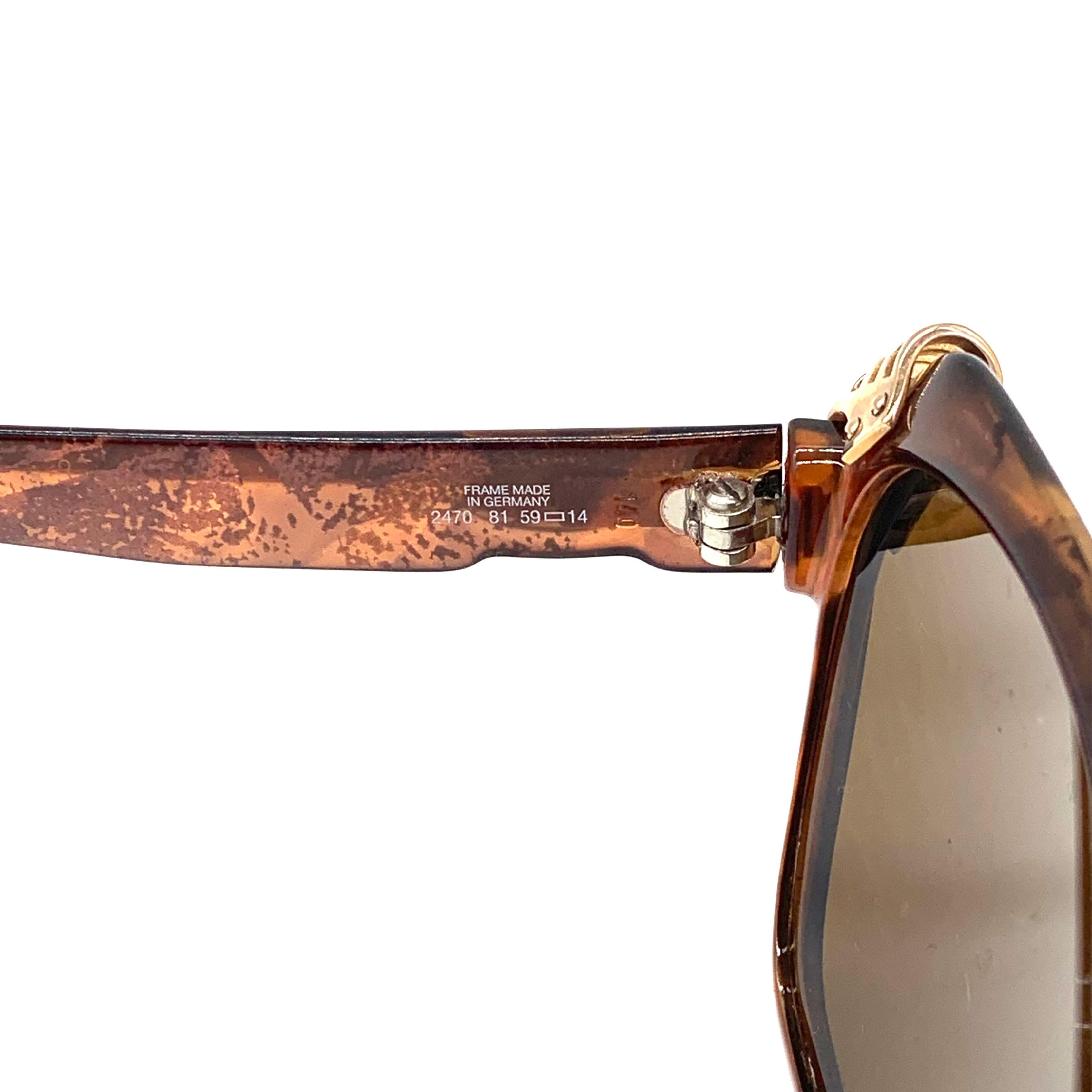 These Christian Dior Optyl Cateye Sunglasses feature a vintage style cateye frame crafted from Optyl, an ultra-lightweight and durable material. The frames are adorned with rhinestone stud detailing on the corners and fit with brown UV lenses for