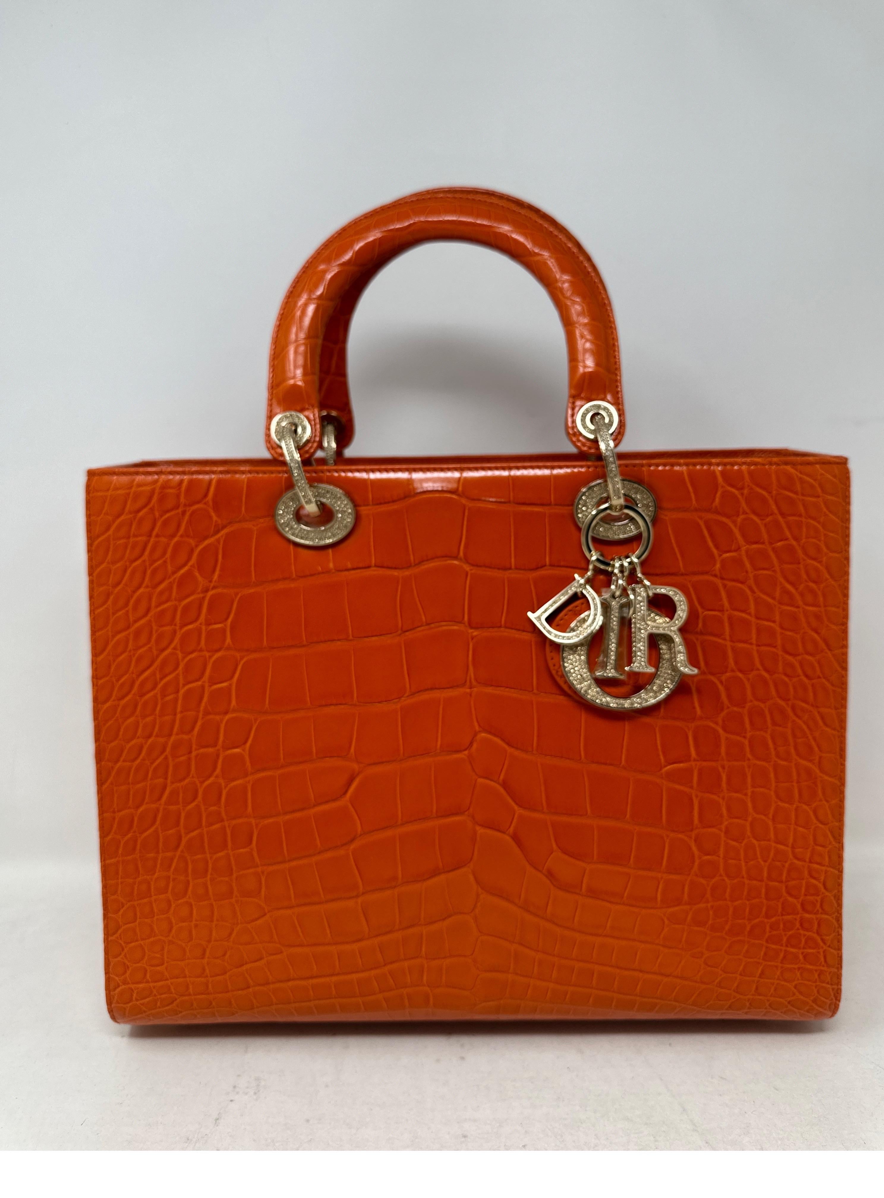 Christian Dior Lady Dior Orange Alligator Bag. Stunning brand new 2023 large Lady Dior Bag with swarovski crystals. Bag has never been used. Rare alligator skin with Cites paperwork. Extremely rare and comes full set with original receipts and all