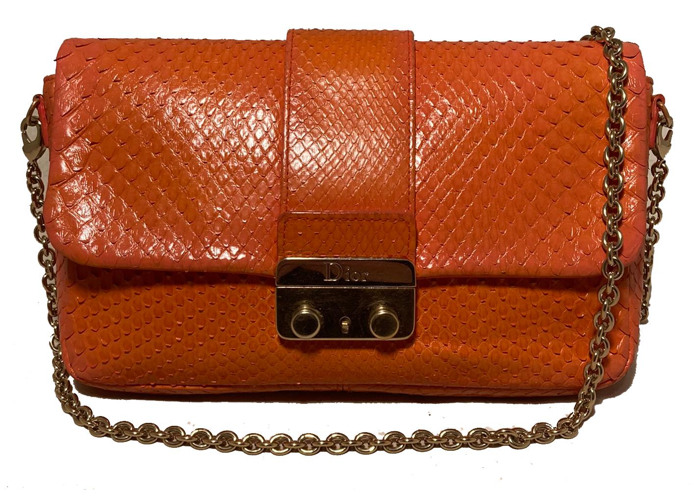 Christian Dior Orange Python Miss Dior Small Flap Bag in excellent condition. Orange python snakeskin exterior trimmed with gold hardware. Front pinch latch closure opens via single flap to an orange leather lined interior that holds one side slit