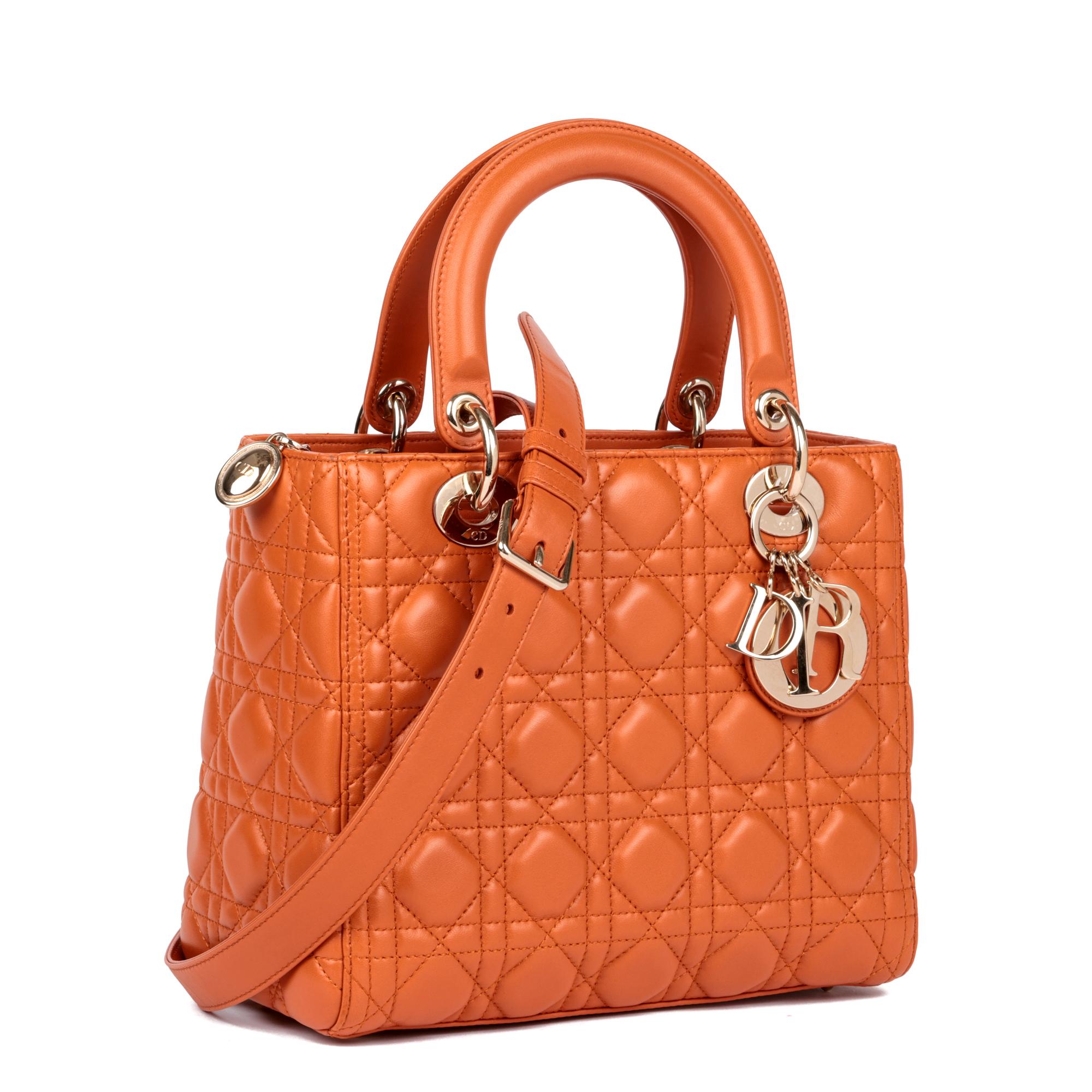 CHRISTIAN DIOR
Orange Quilted Lambskin Leather Medium Lady Dior 

Xupes Reference: HB5101
Serial Number: 09-MA-1117
Age (Circa): 2017
Accompanied By: Christian Dior Dust Bag, Box, Shoulder Strap, Authenticity Card (2019), Care Booklet 
Authenticity