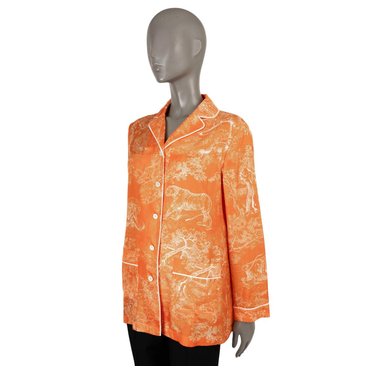 100% authentic Christian Dior pyjama shirt in fluorescent orange Toile de Jouy Reverse silk twill (100%). Features contrasting white piping and two pockets. Closes with buttons on the front and is unlined. Have been worn and are in excellent