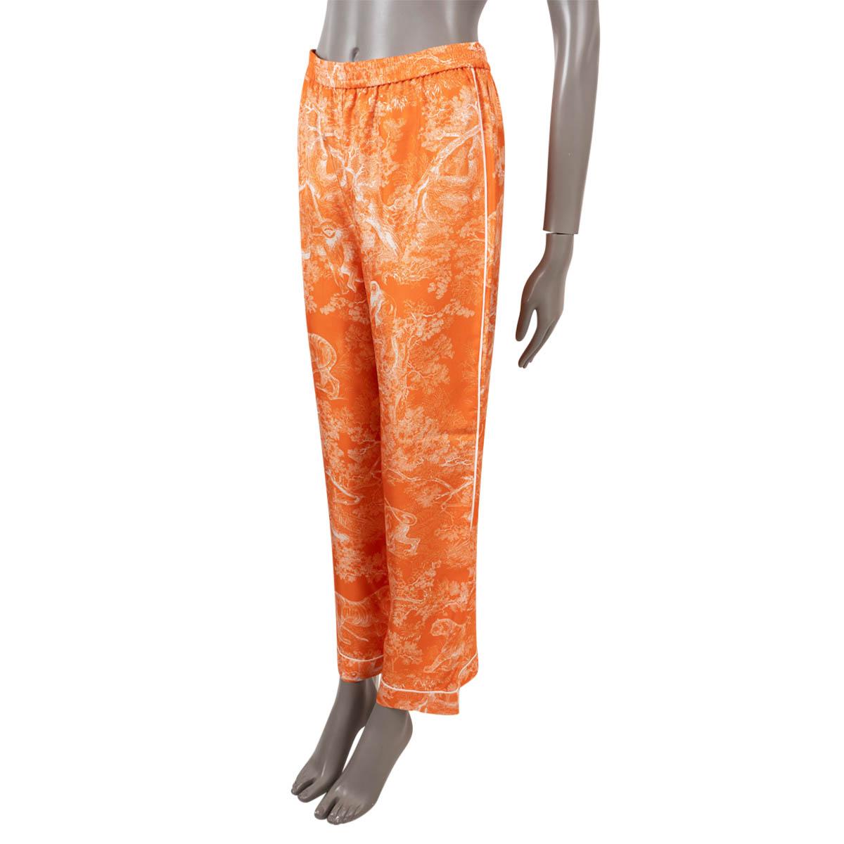 100% authentic Christian Dior pajama pants in fluorescent orange Toile de Jouy Reverse silk twill (100%). Features contrasting white piping, wide legs and elastic waist. Has been worn and is in excellent condition.

Complete the look with matching