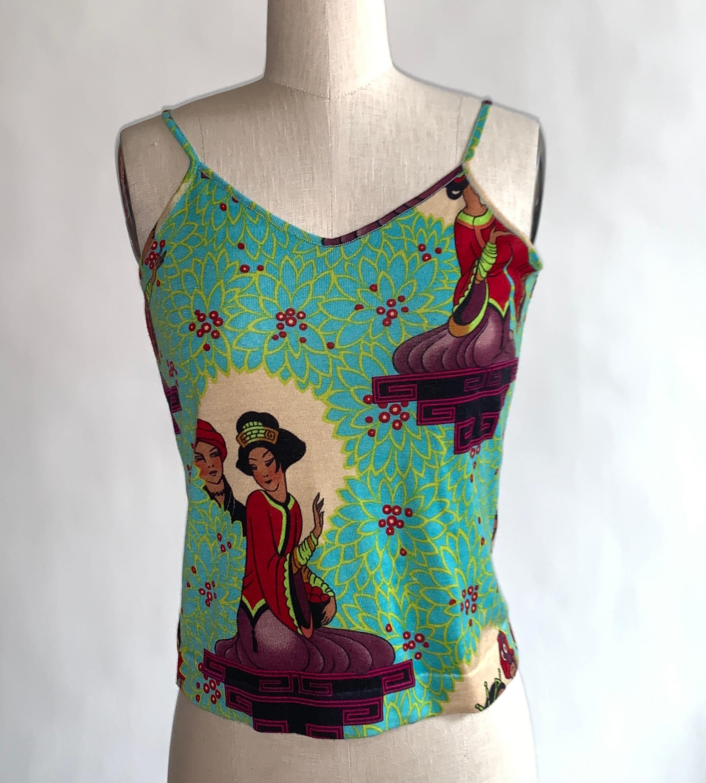 Christian Dior Boutique (1990s?) tank featuring allover greenish yellow floral print and Asian inspired tableaux throughout. Super soft knit with a slight v-neck and thin straps. Pull on, no closure. 

40% wool, 30% silk, 30% cashmere.

Made in