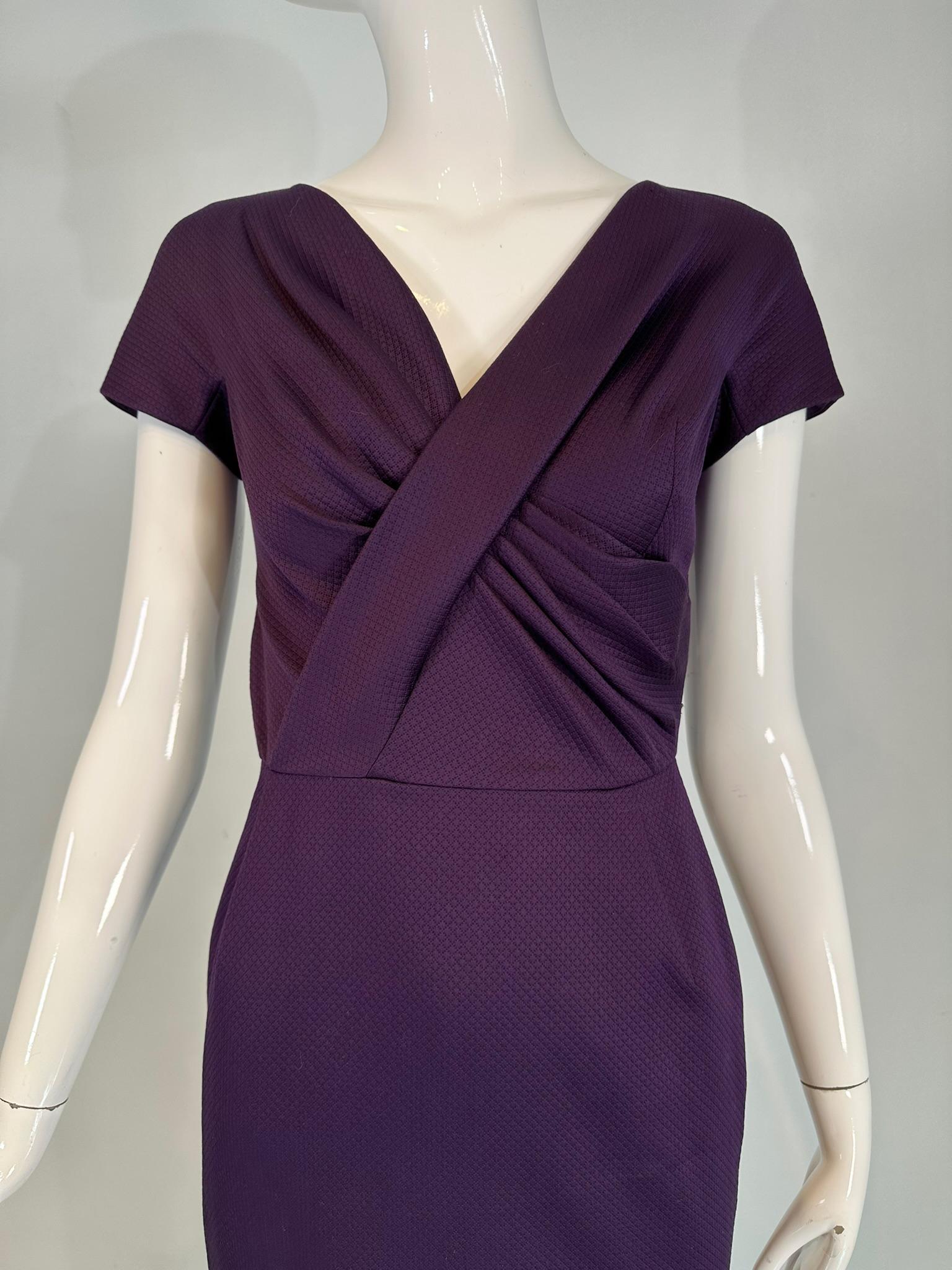 Christian Dior Paris aubergine V neck pleat draped bodice sheath dress. Aubergine silk dobby weave fabric, the bodice features a v wrap neckline with pleats and cap sleeves. A seamed waist and a pencil slim skirt with a center hem back vent makes