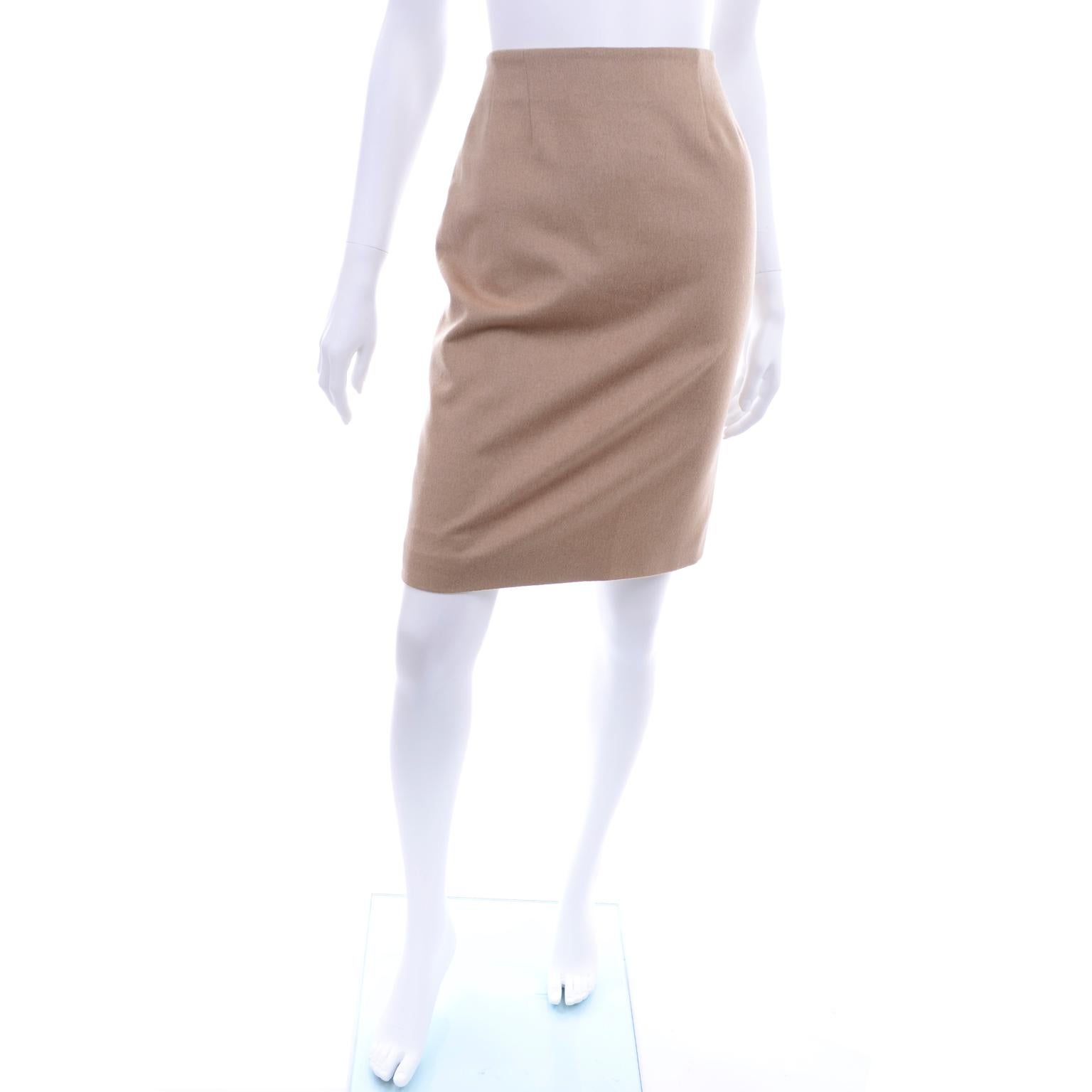 We love this incredible vintage skirt from Christian Dior! The skirt has back buttons down the center seam and is in a beautiful 100% camel fabric with pure silk lining. There are darts on the front and back and a slit down center back from last