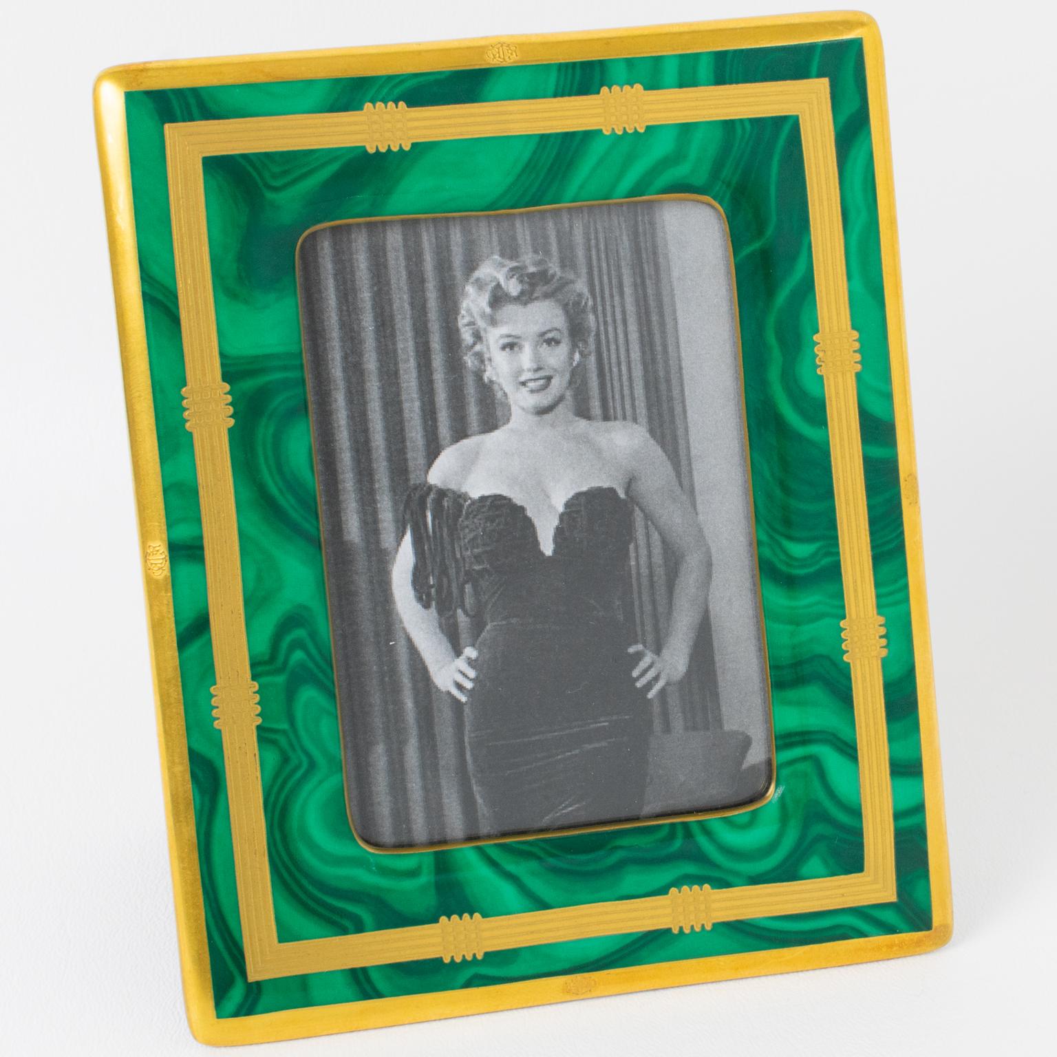 Lovely decorative picture photo frame, designed for the Christian Dior Home collection in the 1980s. Delicate ceramic slab with faux-Malachite textured pattern and gilt application. The easel and back are in felted black fabric. The 