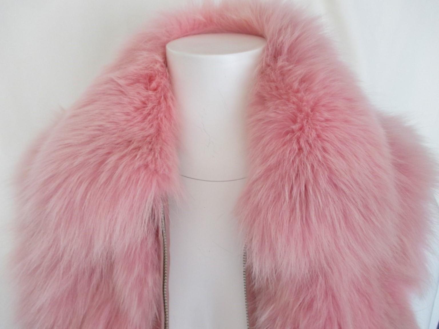 Vintage Christian Dior Boutique Paris sleeveless vest made from dyed pink fox fur with leather.

We offer more luxury fur items, view our frontstore.

Details:
2 pockets, 1 inside pocket and a closing zipper
Silver metallic buckles.
Fully lined with