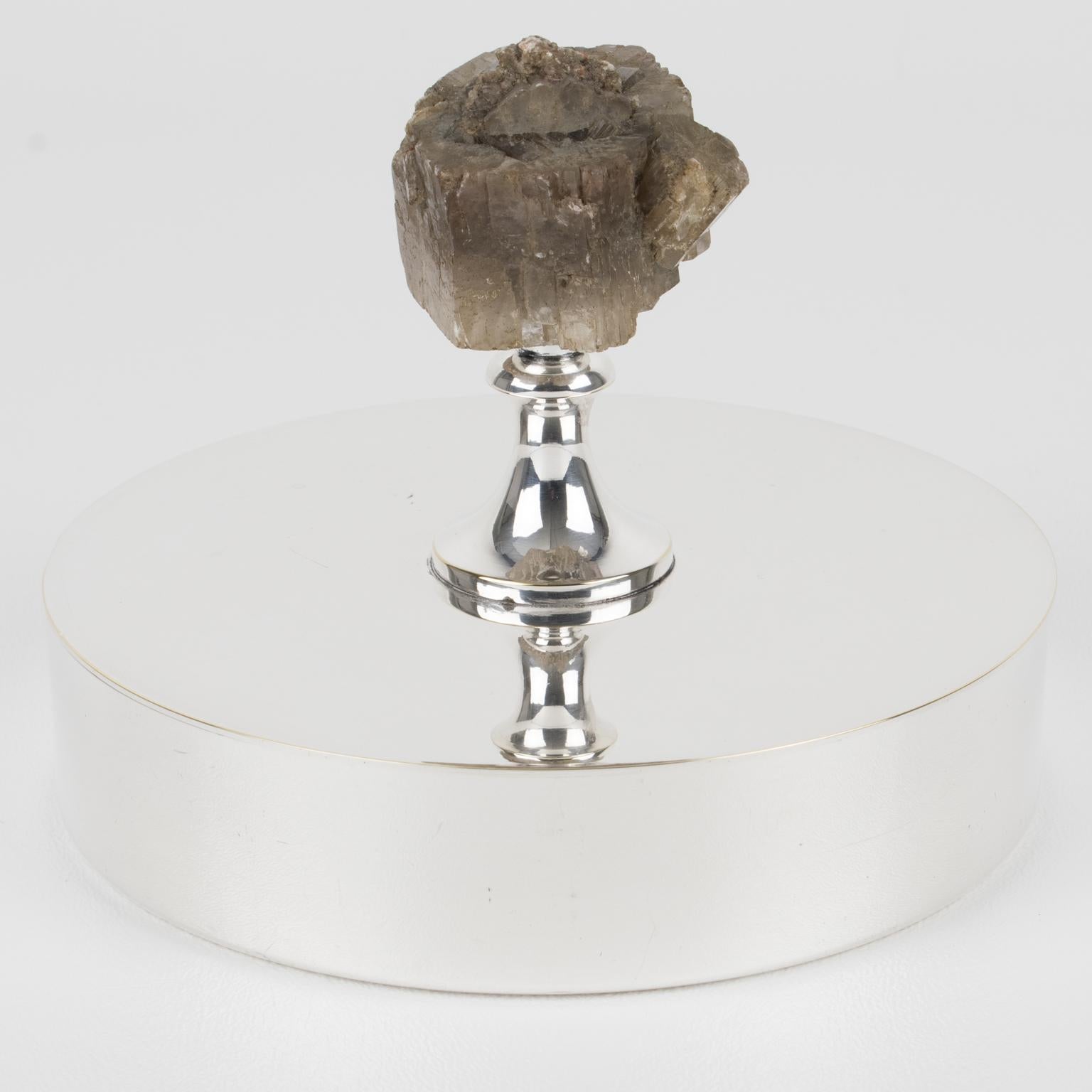 This beautiful modernist silver plate decorative box was crafted in France for the renowned Christian Dior House for his Home Collection. The piece features an elegant minimalist round shape with a lid ornate with a large quartz stone as the finial.