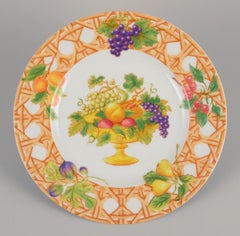 Christian Dior, Paris. Two Tutti Fiori, Tutti Frutti porcelain plates.