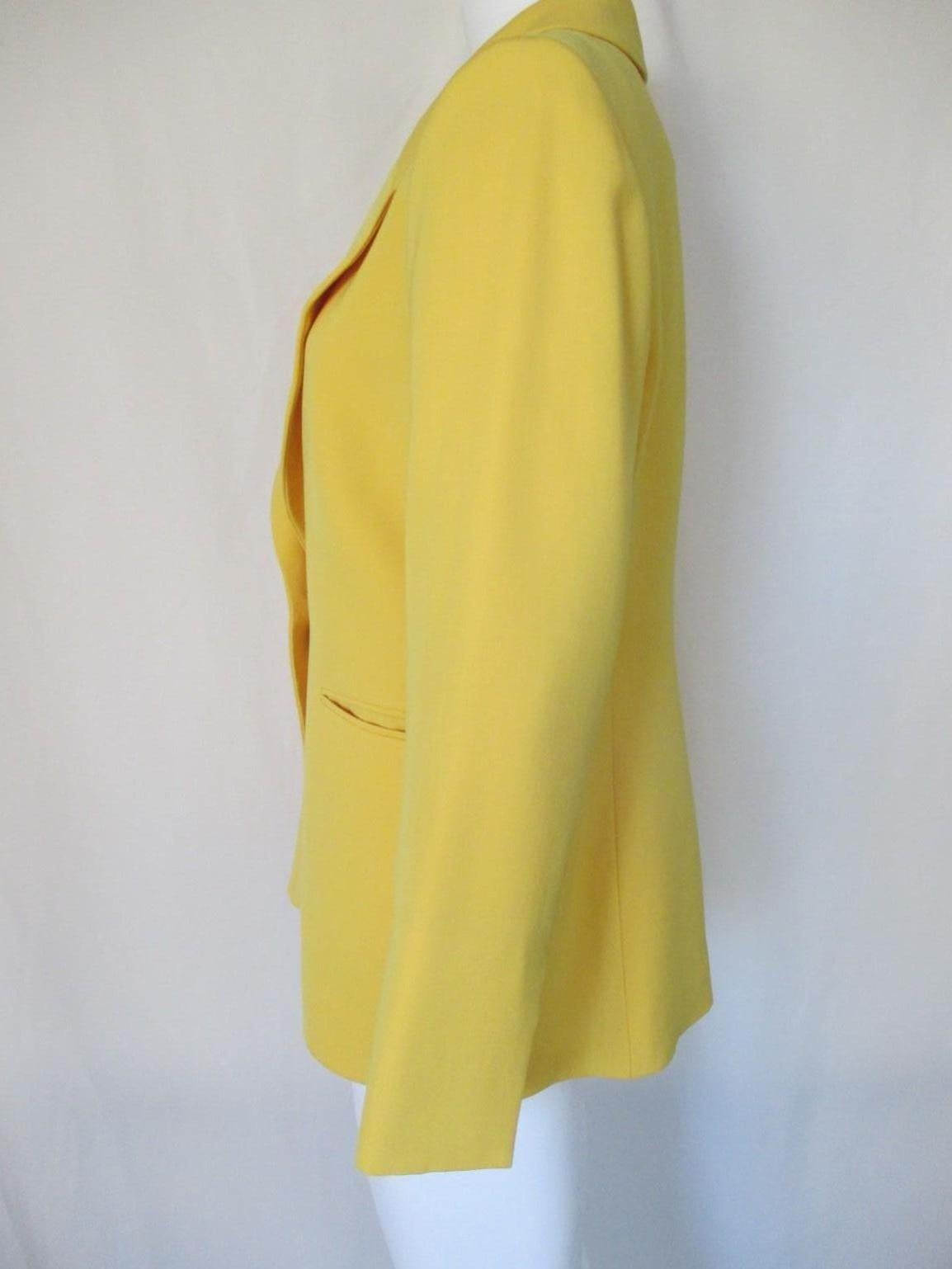 Vintage Christian Dior Boutique jacket with 1 gold color button.
2 pockets
Material: 60% wool / 40% polyester
Color: Yellow
Size is marked  EU France 44 / Germany 42 , medium see section measurements.
This item is professionaly dry-cleaned.
Please