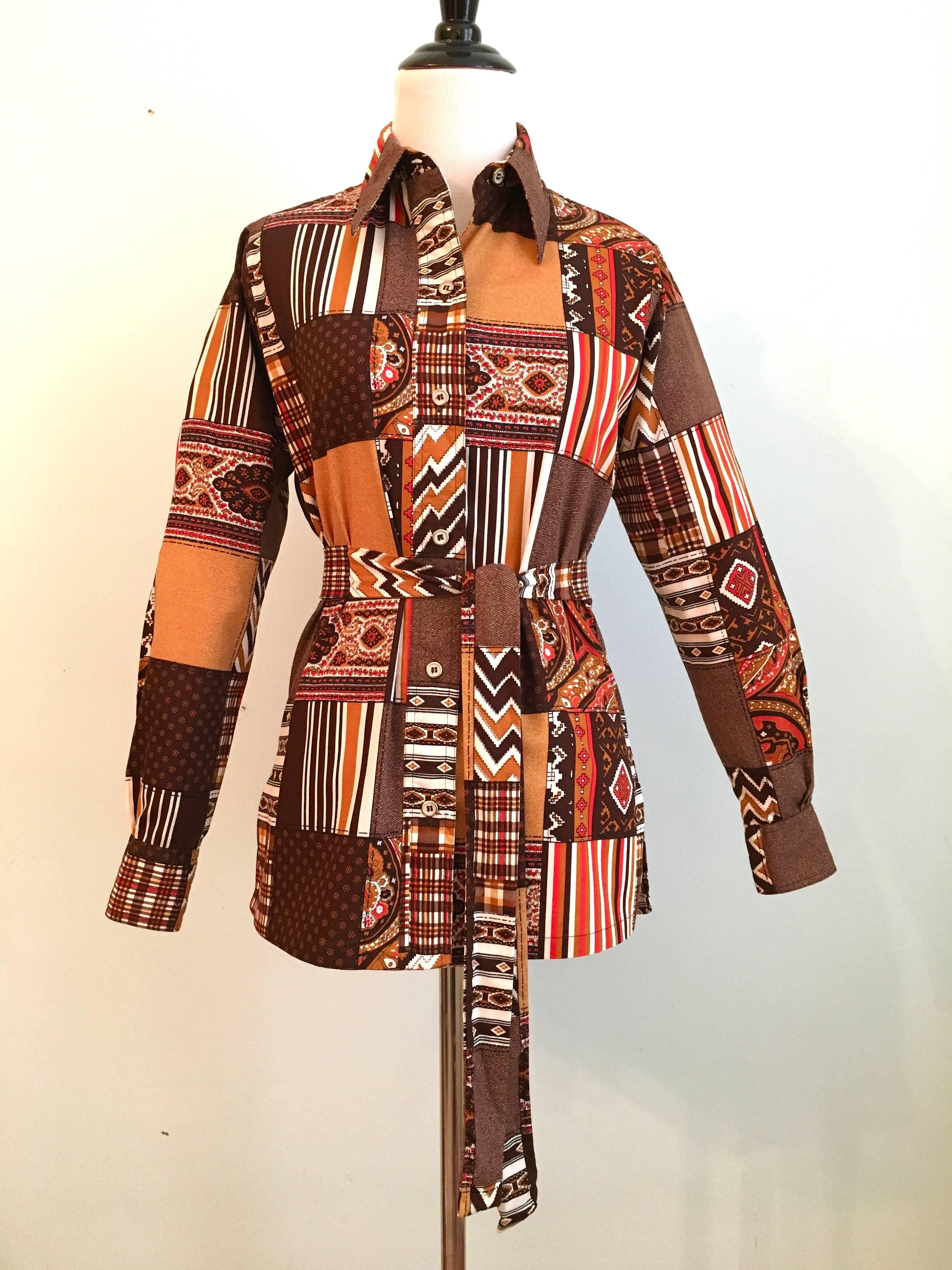 This is a Christian Dior printed patchwork blouse from the 1970s. It is made out of a fabric printed to look as though it is a sewn patchwork fabric. It is marked as a vintage size 8 but actually fits like a modern day size small/extra small. The