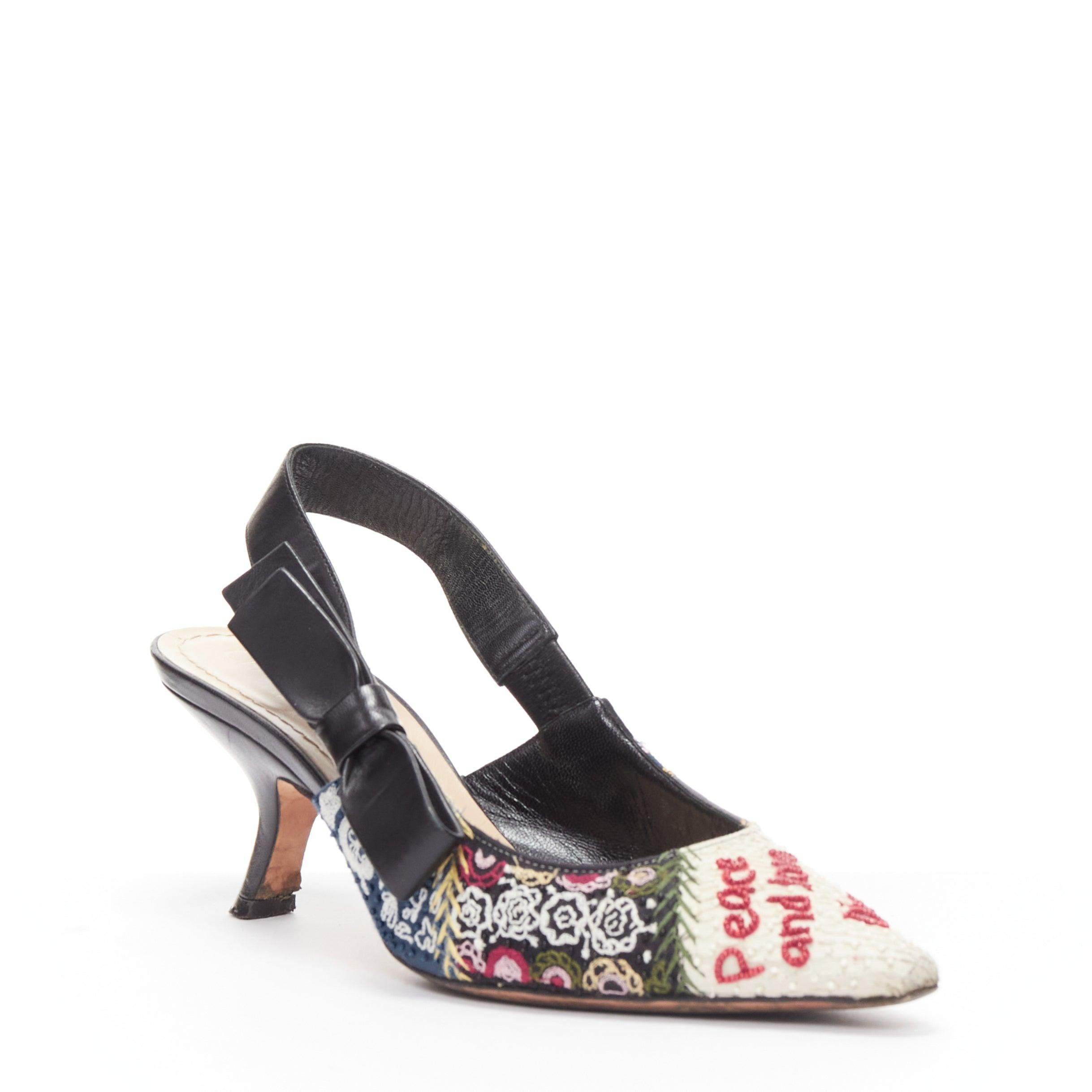 CHRISTIAN DIOR Peace Love bead embroidery bow sling back comma heel pump EU36
Reference: JACG/A00148
Brand: Christian Dior
Material: Fabric, Leather
Color: Multicolour
Pattern: Floral
Closure: Slingback
Lining: Brown Leather
Extra Details: