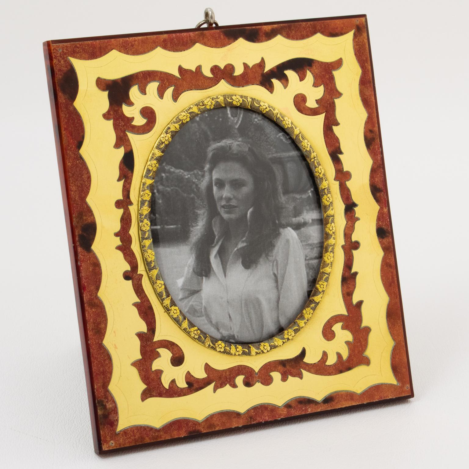 This stunning picture frame was crafted and painted for the Christian Dior Interior Collection circa 1960. The traditional decor, inspired by the style of L'Ecole Boulle in Paris, draws on the classics of this prestigious Parisian cabinetmaking