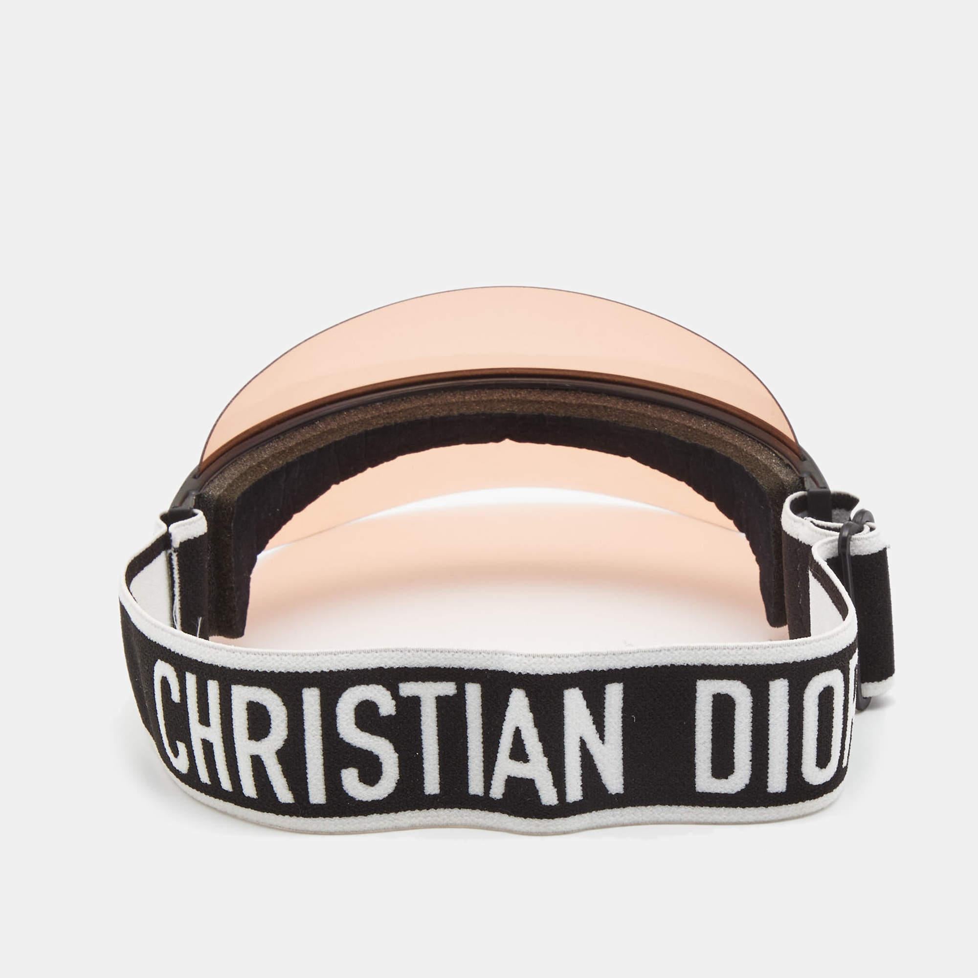 Elevate your summer vacay edit with this Dior Club1 sun visor! It has a pink visor and the brand signature on the front and back. It is perfect for your sunny days out.

