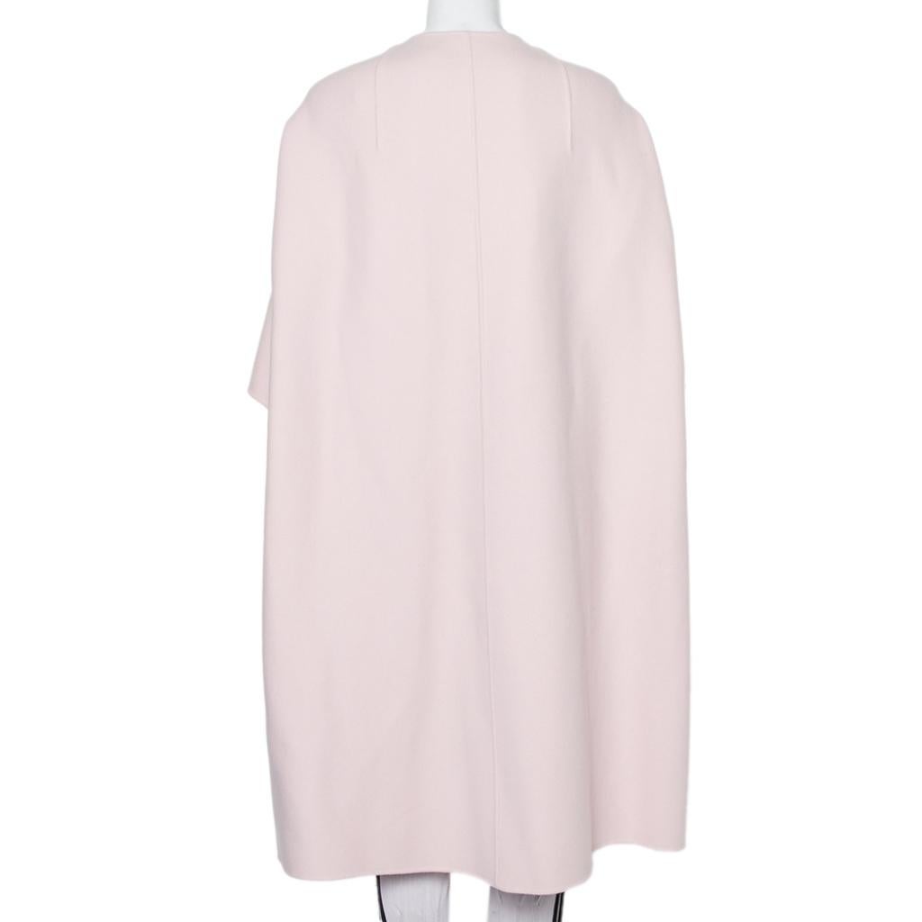 Chic, striking, and exuding sophistication, this Christian Dior coat will fetch you admiring glances from a mile! Lovingly crafted from cashmere, this coat is a creation that will instantly elevate your ensembles. The buttoned front, mid-length