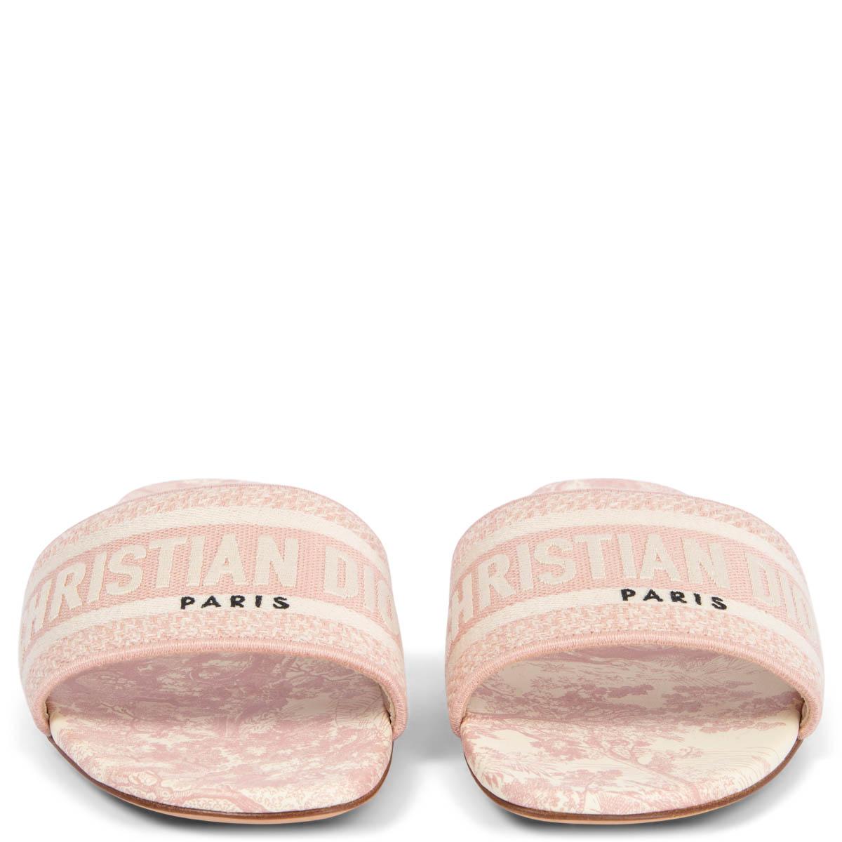 100% authentic Dior DWAY Toile De Jouy embroidered slides in dusty rose and off-white canvas with printed calfskin insole. Brand new. Come with dust bag. 

Measurements
Imprinted Size	38
Shoe Size	38
Inside Sole	25cm (9.8in)
Width	8cm (3.1in)

All