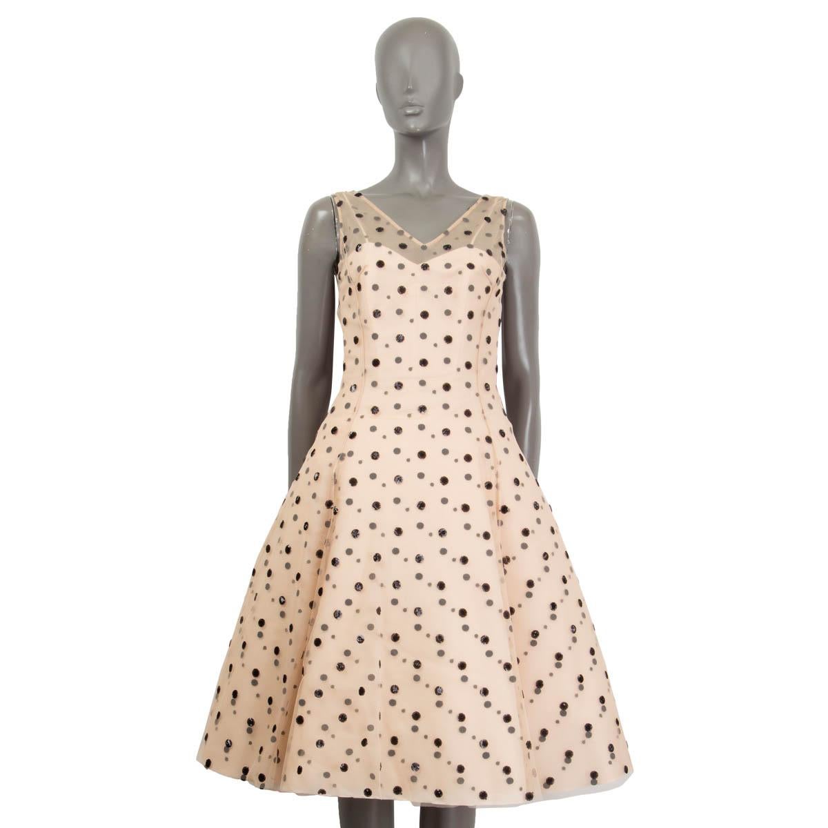 100% authentic Christian Dior 2016 sequin dotted tulle dress in dusty rose and black silk (100%). Features an a-line fit and a v-neck. Slip dress and overdress both open with a concealed zipper and a hook at the back. Lined in dusty rose silk