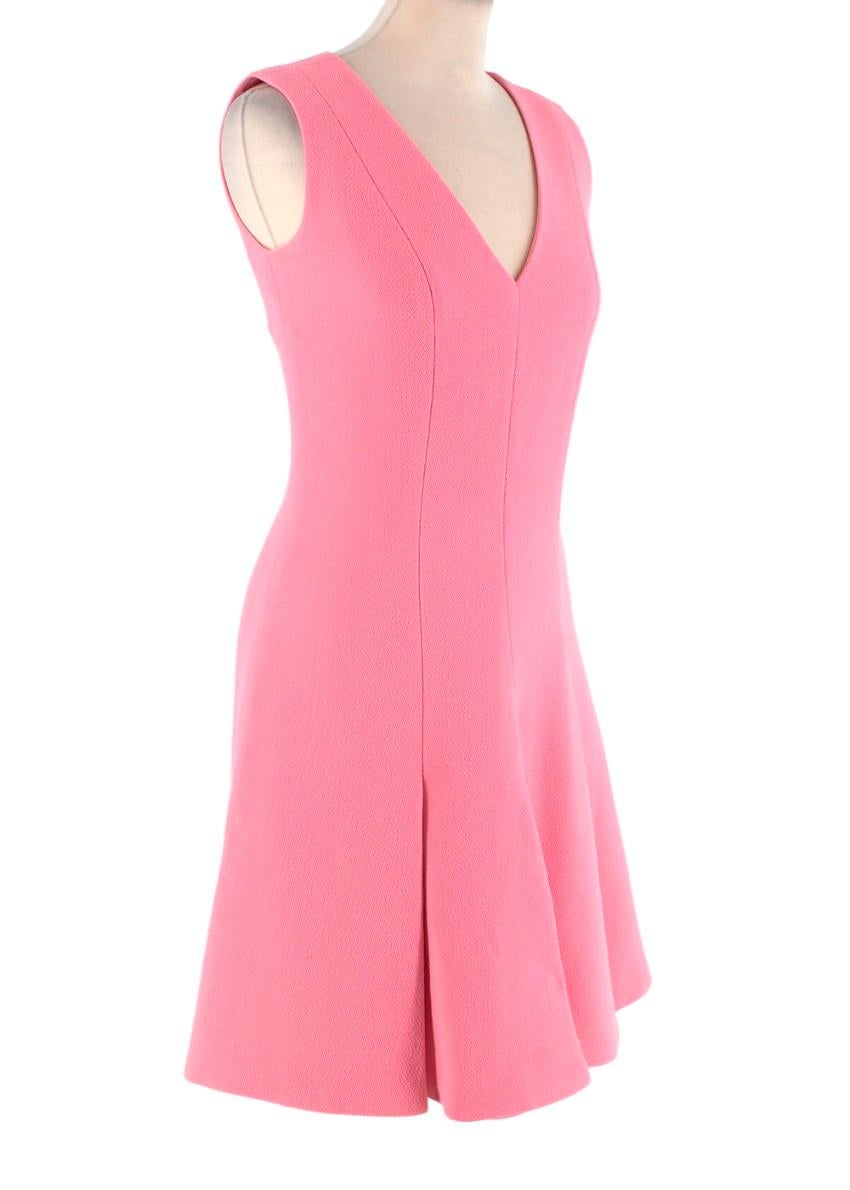  Christian Dior Pink Wool Crepe Pleated V-Neck Dress
 

 - Wool crepe dress in bright pink
 - Knife pleat hem with lovely movement 
 - Deep V-neckline, concealed back zip closure, fully lined
 

 Materials:
 100% Wool
 Lining - 100% Silk
 

 Made in