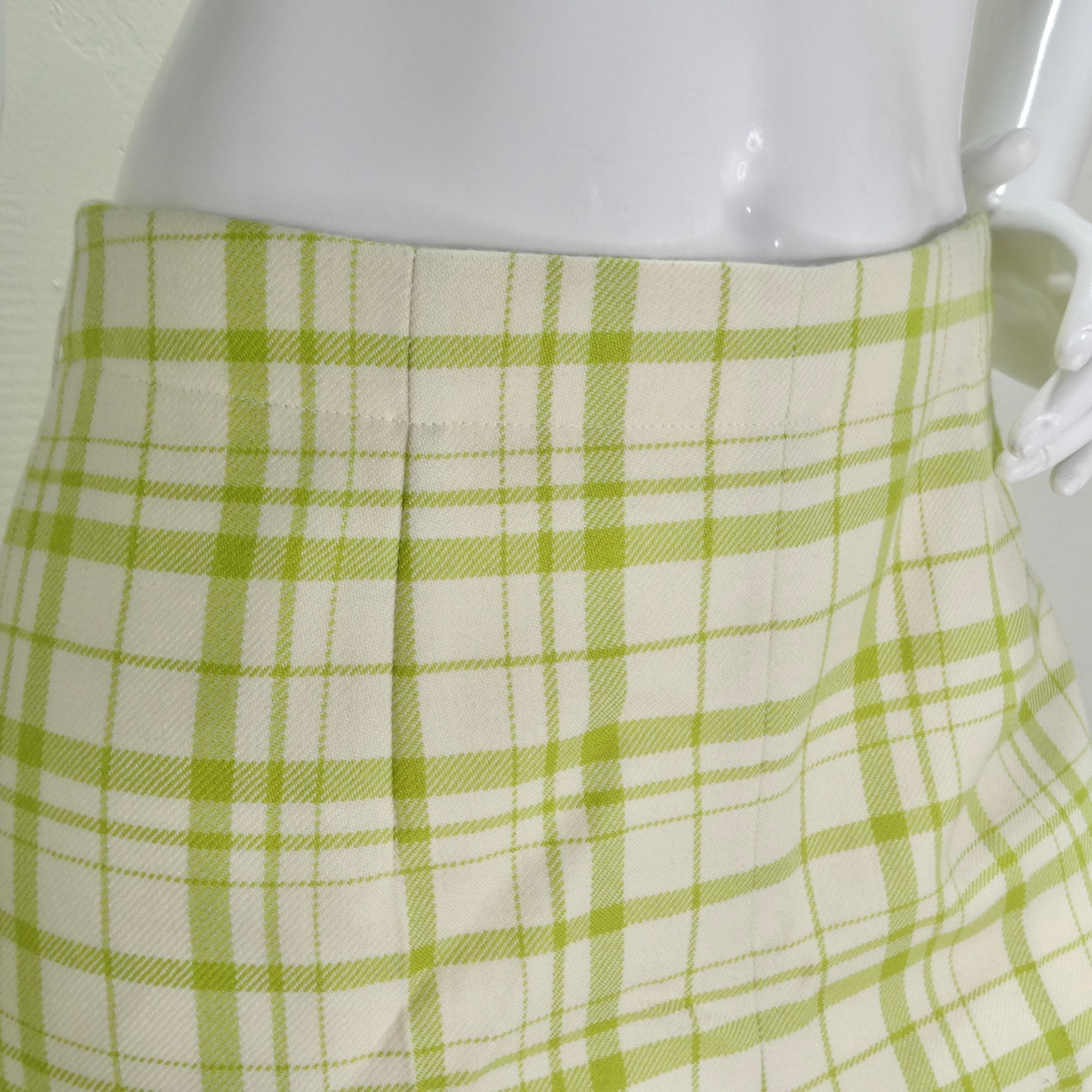 Embrace a timeless and elegant look with the Christian Dior Plaid Wool Shorts – a luxurious and fun addition to your wardrobe. Crafted from yellow tone lime green and white plaid wool, these shorts exude a classic charm that transcends trends. The