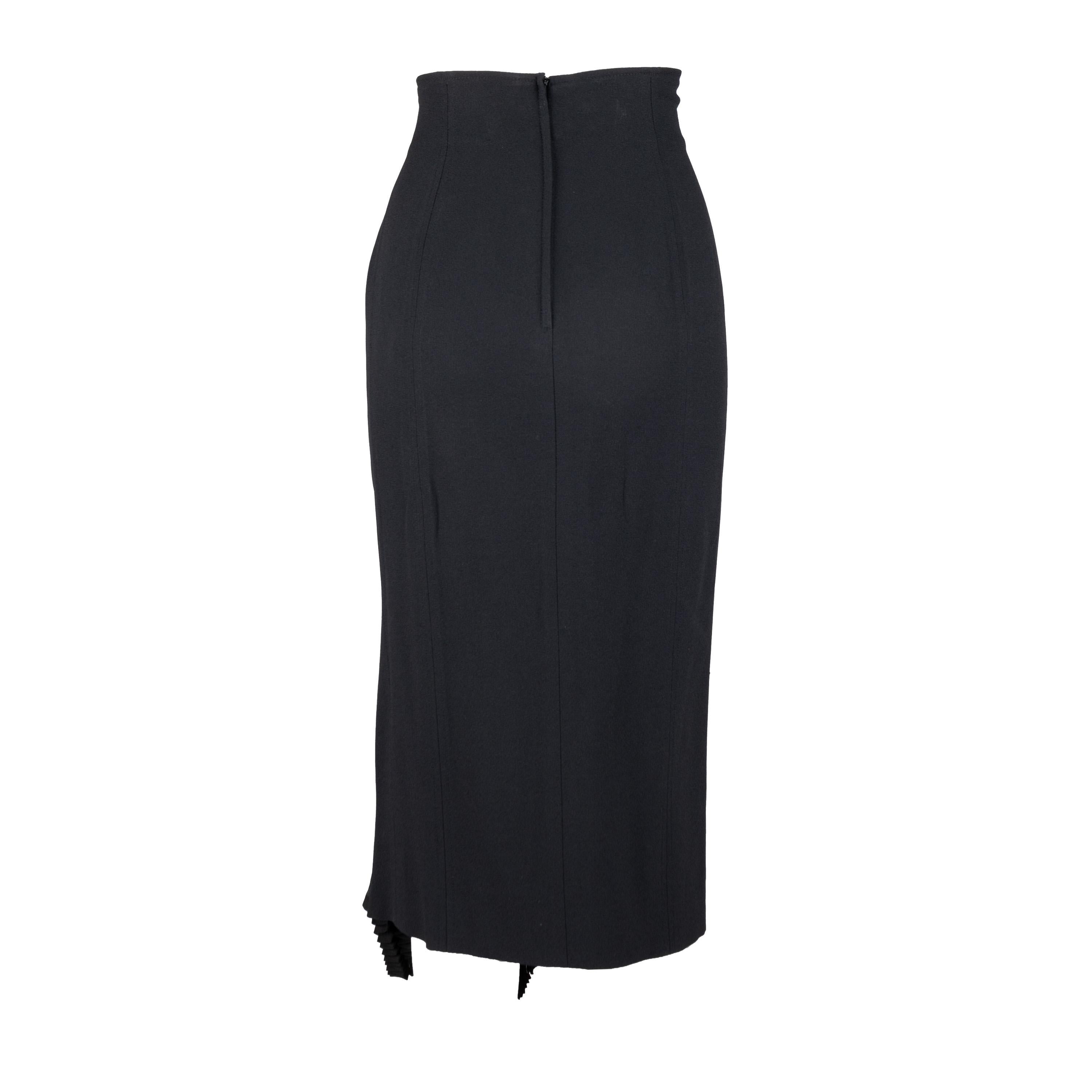 This one-of-a-kind Christian Dior skirt is crafted from a luxurious viscose blend in a timeless black hue. Its sleek and fitted silhouette features a high-waisted design with a discreet back zipper. The defining feature is the accordion pleat