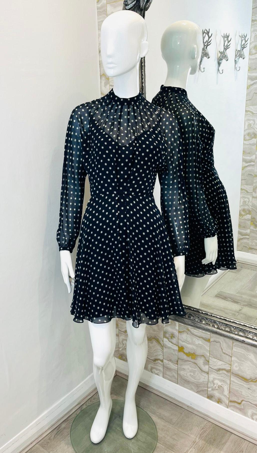 Christian Dior Polka Dot Silk Dress

Black, mini dress designed with polka-dot print in white.

Featuring standing collar, and see-though detailing to the neckline and sleeves.

Detailed with pleated, A-Line skirt and concealed zip closure to