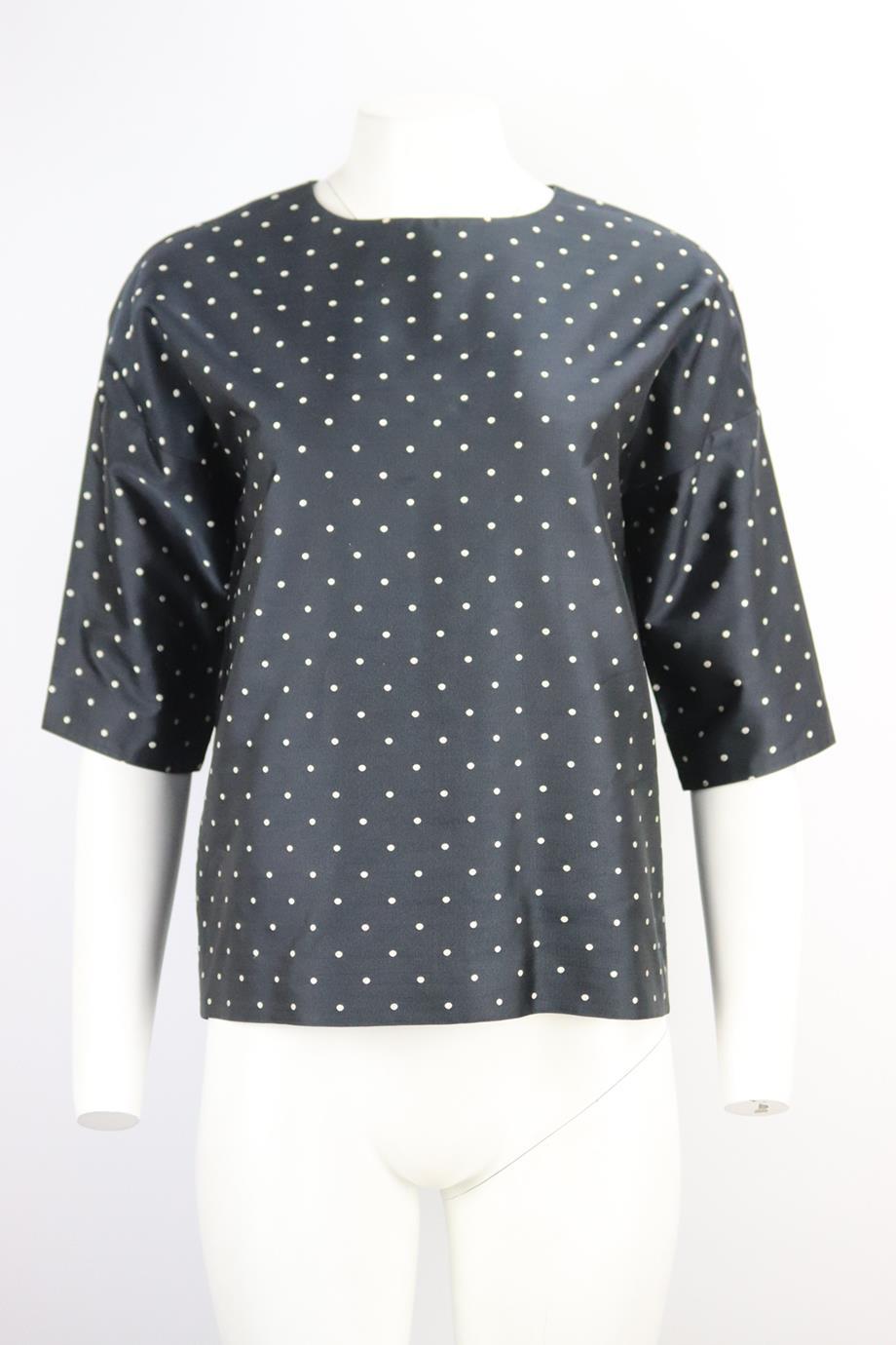 Christian Dior polka dot silk twill top. Black. Sleeveless, crewneck. Button fastening at back. 100% Silk; lining: 100% silk. Size: FR 36 (UK 8, US 4, IT 40). Bust: 43 in. Waist: 42 in. Hips: 38.5 in. Length: 24 in.Very good condition - Few light