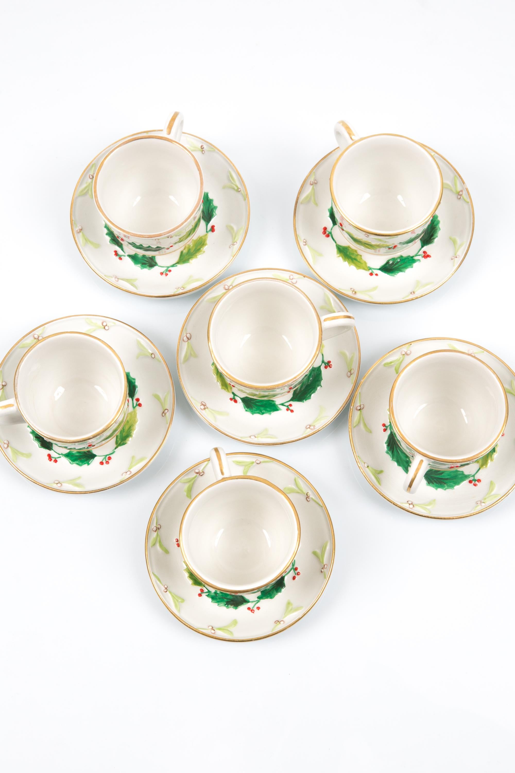 Christian Dior Multicolor porcelain six cups and matching saucers “holly” tableware set featuring 6 cups and matching saucers, gold-plated finishing, holly design, saucers stamped. 
Circa 1990  Made in France
In good vintage condition. 
Cups height: