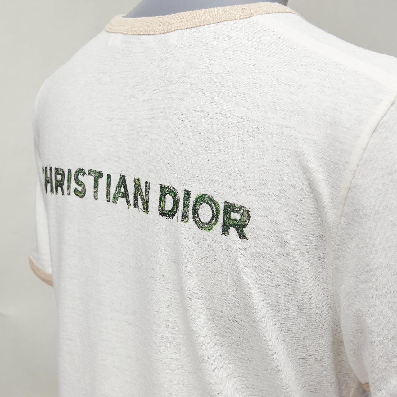 CHRISTIAN DIOR Princess and Dragon green cream beige foil print ringer tshirt XS
Reference: AAWC/A00789
Brand: Dior
Designer: Maria Grazia Chiuri
Material: Cotton, Linen
Color: Cream, Green
Pattern: Abstract
Closure: Pull On
Extra Details: CHRISTIAN