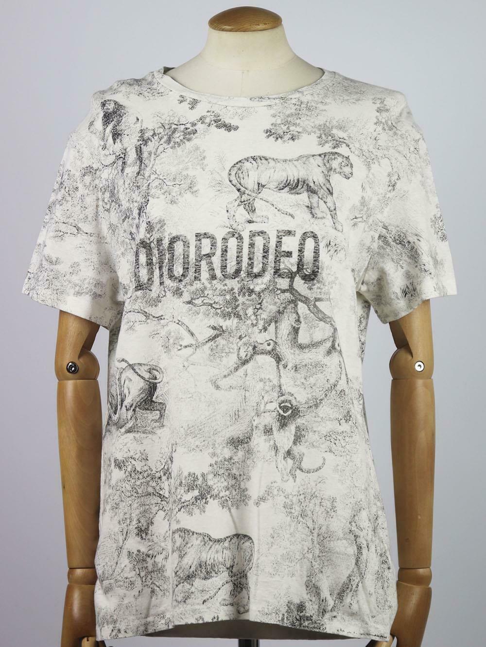 Christian Dior's T-shirt is printed with the house's iconic design - 'DIORODEO' in a graphic typeface over Dior's iconic Toile de Jouy print, it's made from super soft ivory and balck cotton and linen-blend and is cut for a relaxed fit.
Ivory and