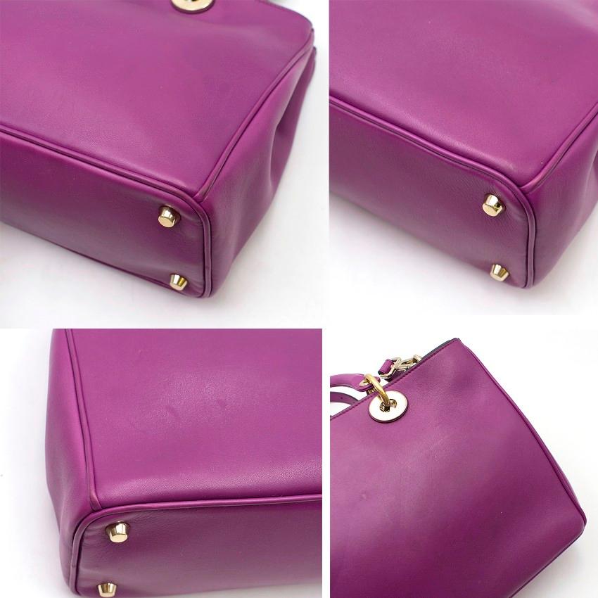 Christian Dior Purple Leather Diorissimo Bag

- Two top handles with an adjustable & detachable shoulder strap
- Gold-tone metal hardware
- Classic DIOR letter bag charm
- Popper closure to the main compartment
- Removable pouch with strap to attach