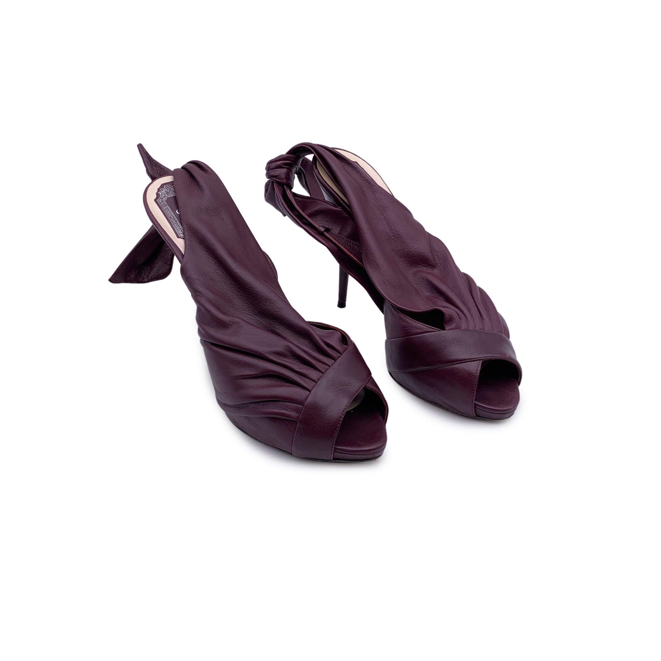 Christian Dior purple plum pleated leather peep toe heels. Slingback D'orsay design with bow detailing on the back. They feature an almond toe, slip on design and a plastic heels with twist design. Heels Height: 5 inches - 13 cm. Made in Italy.