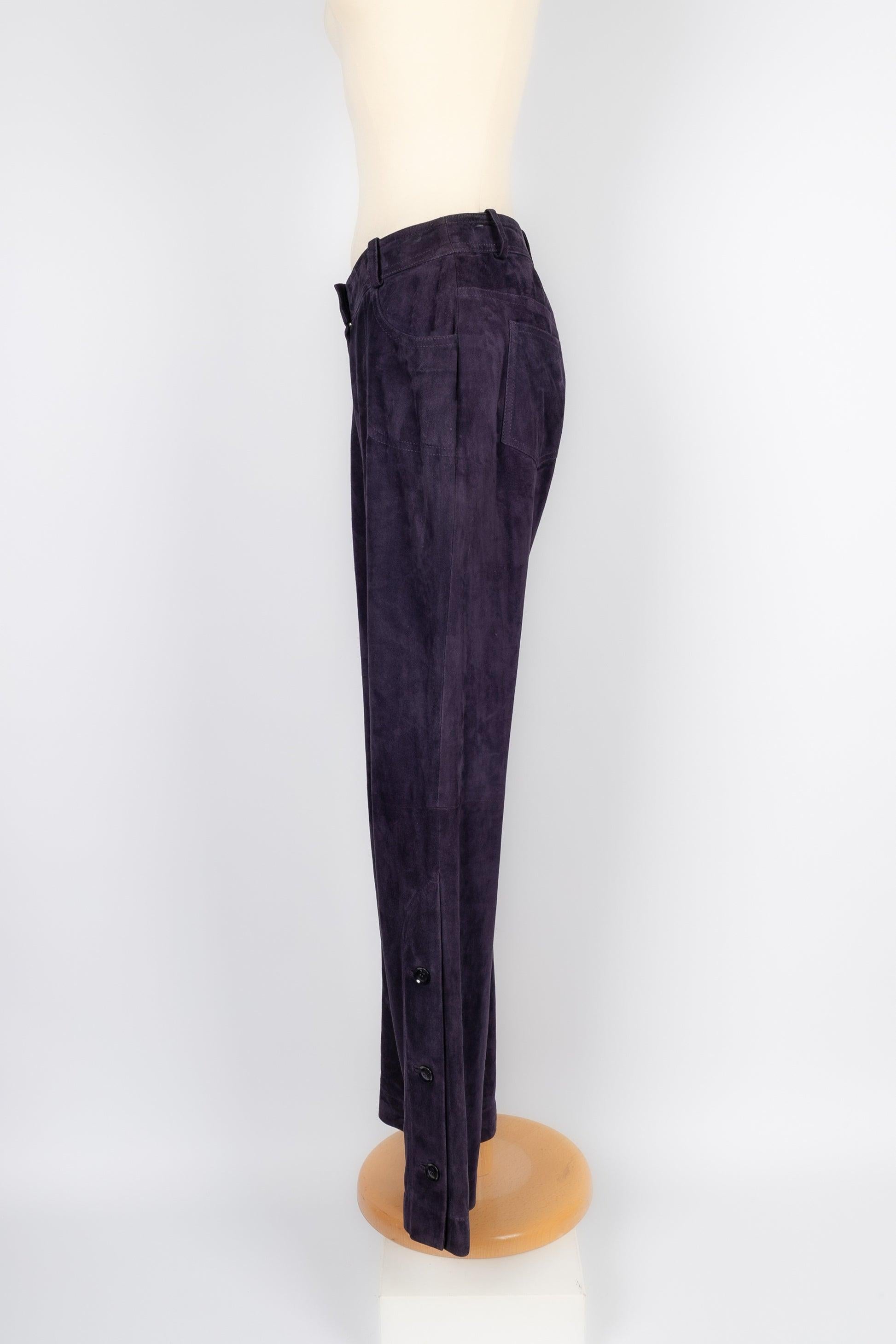 Dior - (Made in France) Purple suede pants ornamented with buttons on the pants' bottom. 38FR size indicated.

Additional information:
Condition: Good condition
Dimensions: Waist: 38 cm - Hips: 45 cm - Length: 100 cm

Seller Reference: FJ88

