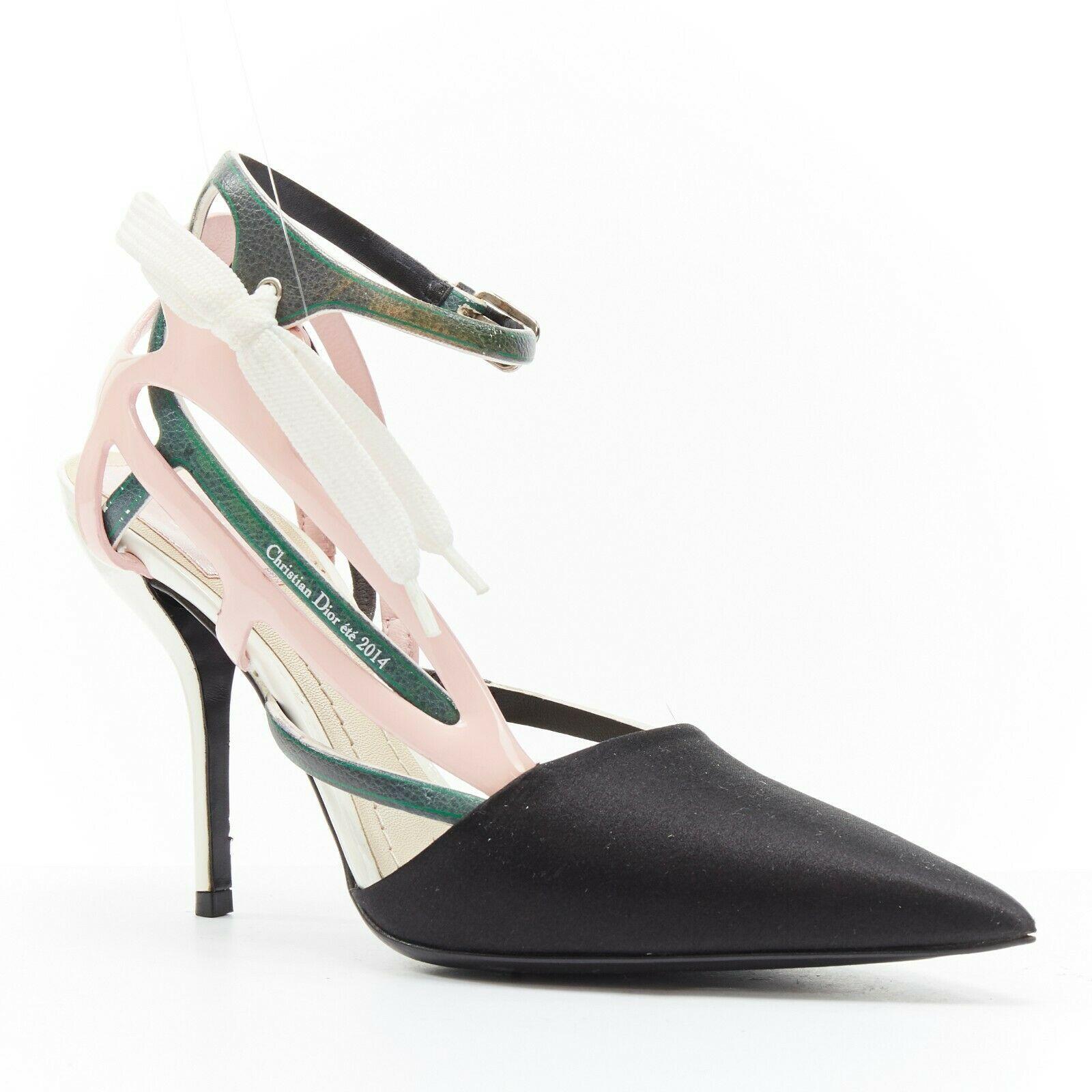 CHRISTIAN DIOR RAF SIMONS black dorsay toe green pink lace ribbon heels EU36
CHRISTIAN DIOR BY RAF SIMONS
Black satin pointed toe. Dorsay heel. 
Pink patent and green printed leather strappy upper. White nylon lace ribbon detailing. 
Ankle strap
