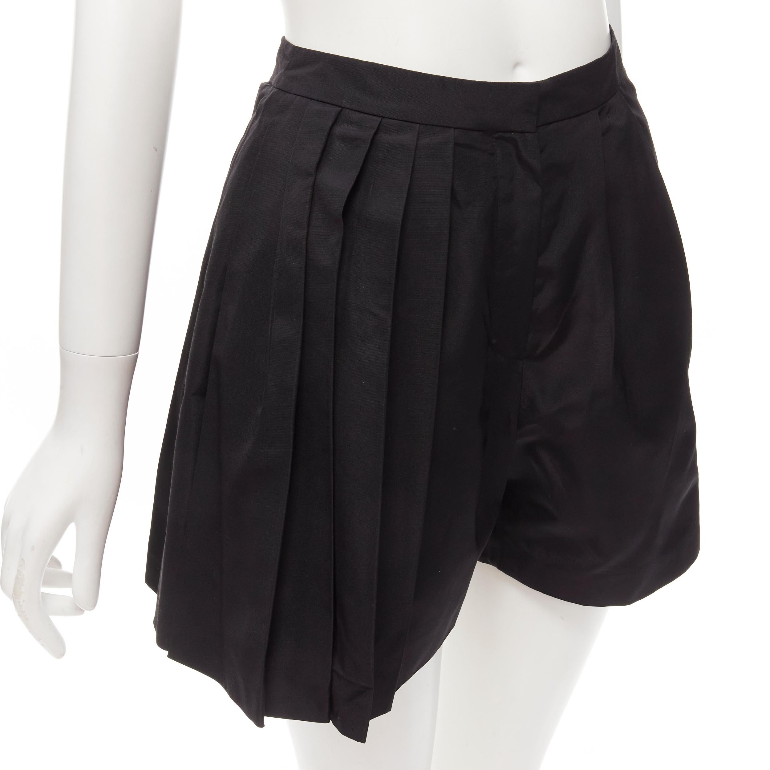 CHRISTIAN DIOR Raf Simons black silk asymmetrical pleated flared shorts FR34 XS
Reference: AAWC/A00368
Brand: Christian Dior
Designer: Raf Simons
Material: 100% Silk
Color: Black
Pattern: Solid
Closure: Zip Fly
Extra Details: One slit pocket at the