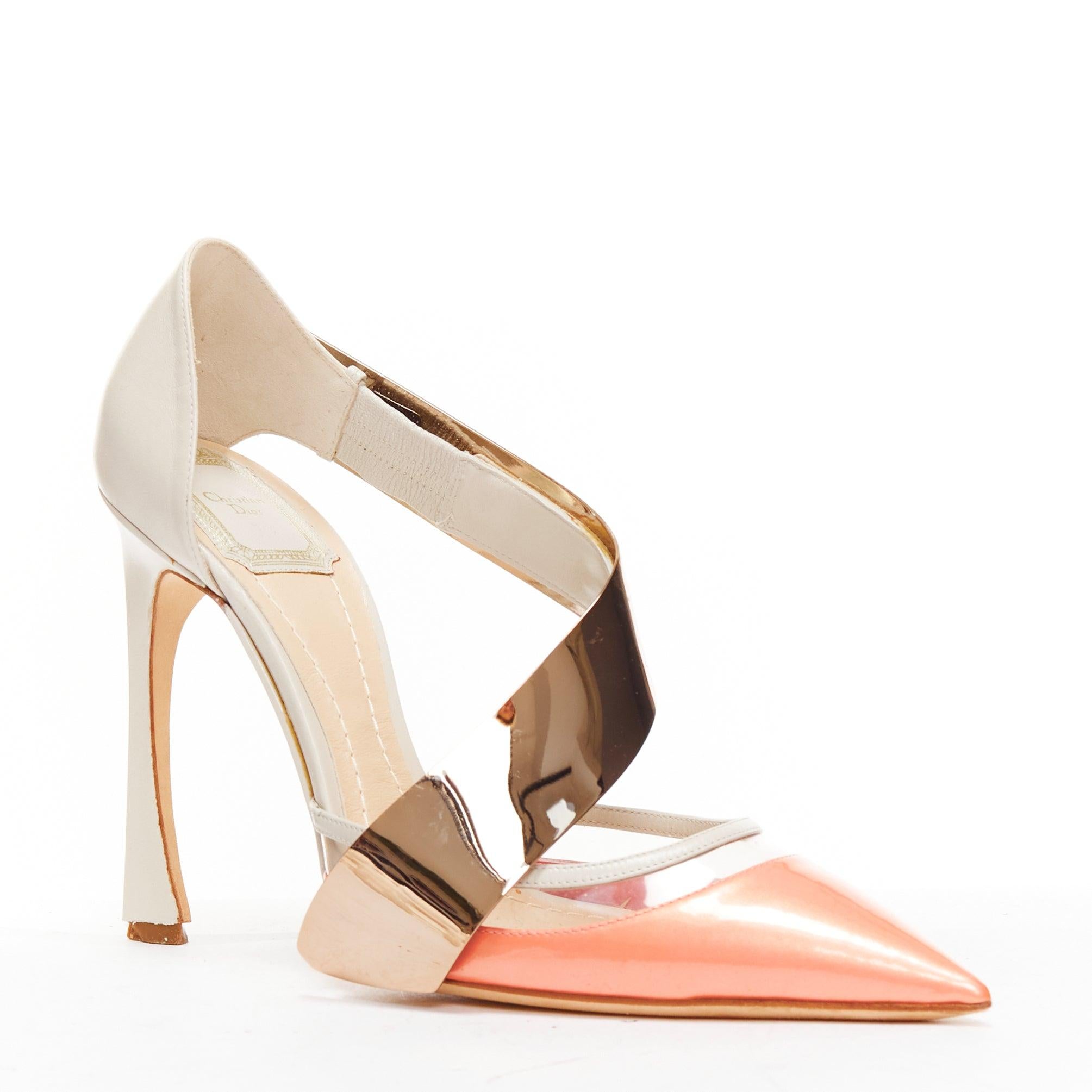 CHRISTIAN DIOR Raf Simons metal bar pink patent curved heel pumps EU38
Reference: BSHW/A00153
Brand: Christian Dior
Designer: Raf Simons
Material: Patent Leather, Metal, PVC
Color: Pink, Rose Gold
Pattern: Solid
Closure: Elasticated
Lining: Nude