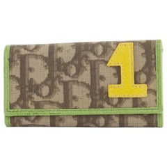 CHRISTIAN DIOR Rasta brown monogram yellow '1' patch green trim flap keyholder