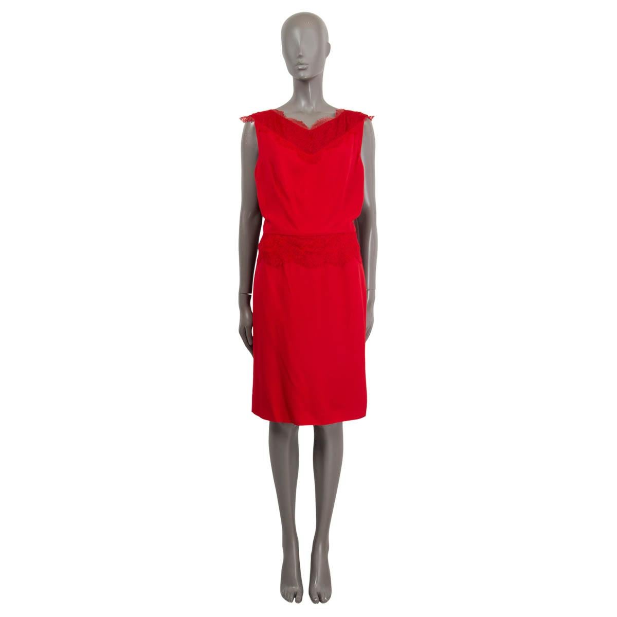 100% authentic Christian Dior sleeveless cocktail dress in red acetate (57%) and viscose (43%) with lace details around the waist, chest and shoulders. Open back with twisted strap detail. Opens with a zipper on the back and is lined in silk (100%).