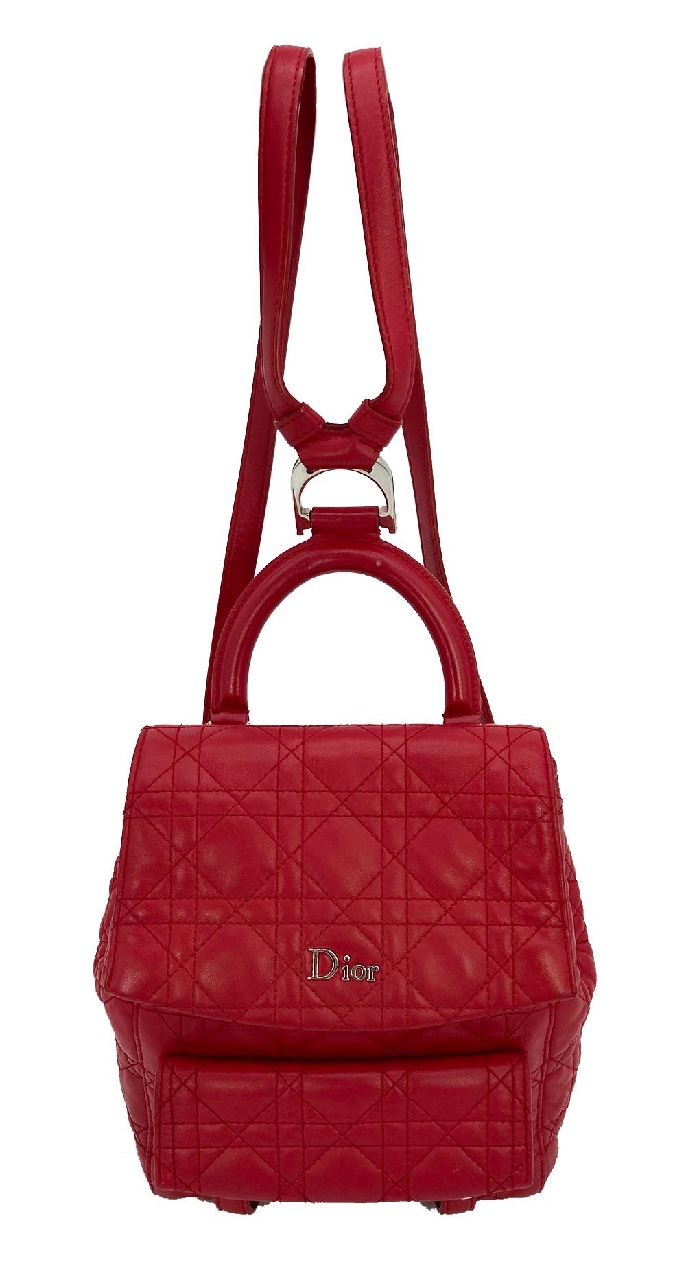 Christian Dior Red Cannage Quilted Leather Stardust Backpack in excellent condition. Cherry red lambskin leather exterior in siganature cannage quilt pattern trimmed with silver hardware. Double adjustable back straps and top handle with D ring logo