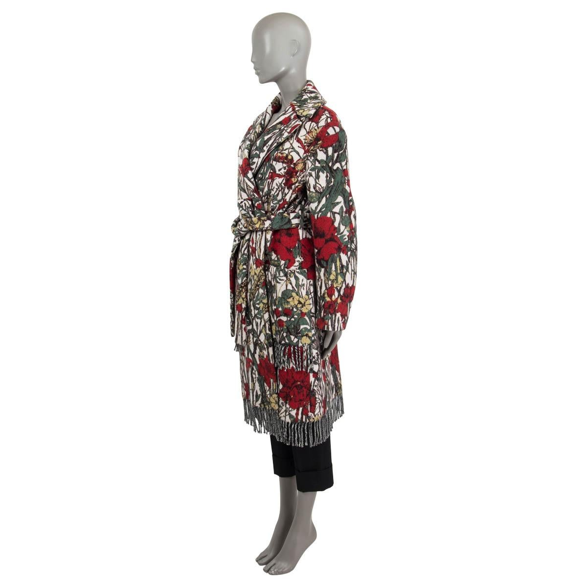100% authentic Christian Dior floral fringed knit coat in red, green and light gray wool (100%). Features a detachable belt, belt loops and two patch pockets on the front. Unlined. Has been worn once or twice and is in virtually new condition.

2021