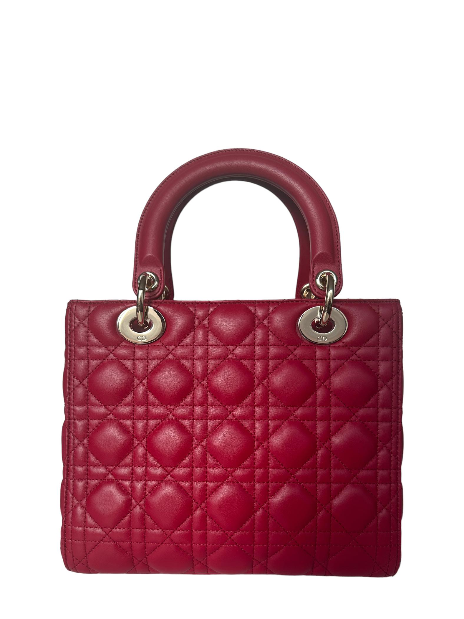 Christian Dior Red Leather Cannage Quilted Medium Lady Dior Bag

Made In: Italy
Year of Production: 2023
Color: Red
Hardware: Goldtone
Materials: Lambskin Leather
Lining: Suede
Closure/Opening:Center flap
Exterior Pockets: None
Interior Pockets: 