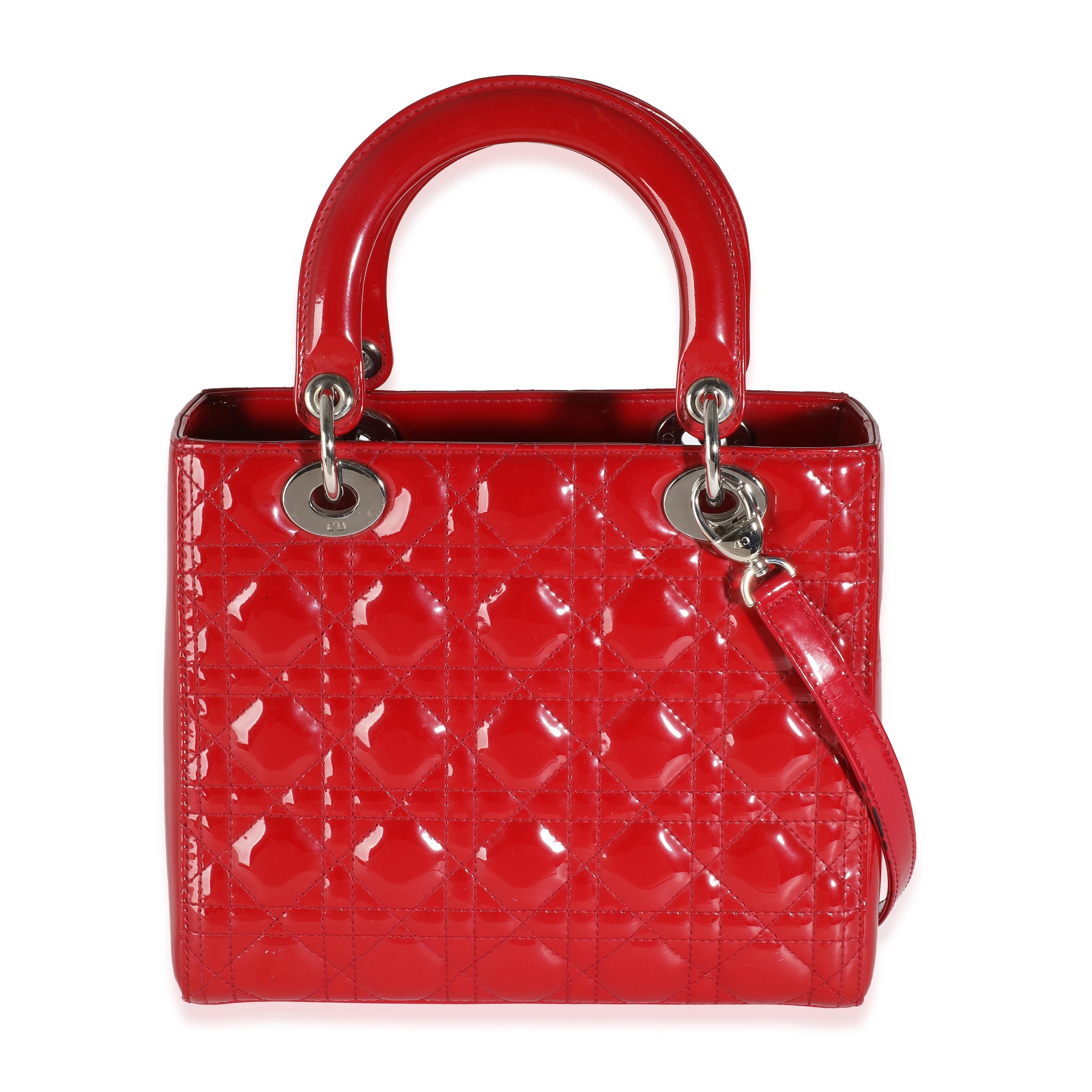 Listing Title: Christian Dior Red Patent Cannage Medium Lady Dior
SKU: 143912
Condition: Pre-owned 
Condition Description: Originally named the 'Chouchou', the Lady Dior bag from Dior was renamed after Princess Diana carried the bag at the Grand